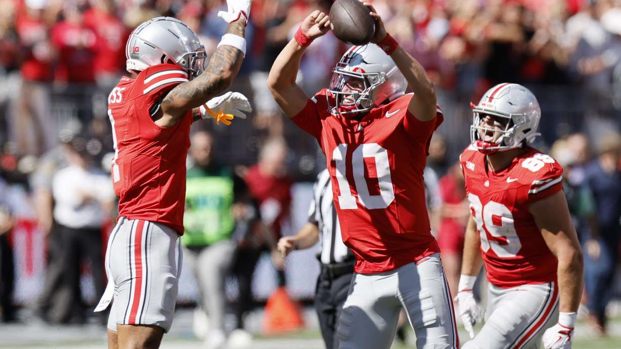 Ohio State receiver Brandon Inniss, left and quarterback Julian Sayin celebrate their win over Texas following an NCAA college football game, Saturday, Aug. 30, 2025, in Columbus, Ohio.