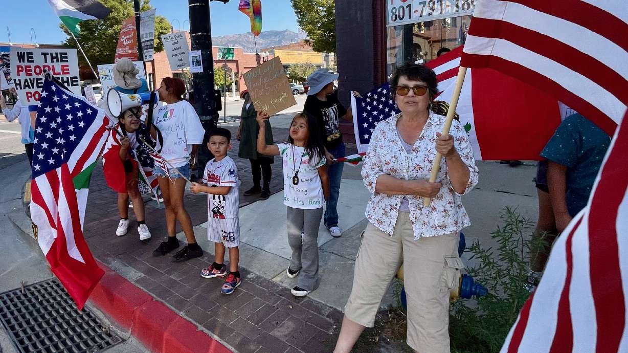 Demonstrators against President Donald Trump's administration protest on Wall Avenue in Ogden on Monday, as part of Labor Day protests planned around Utah and the country.