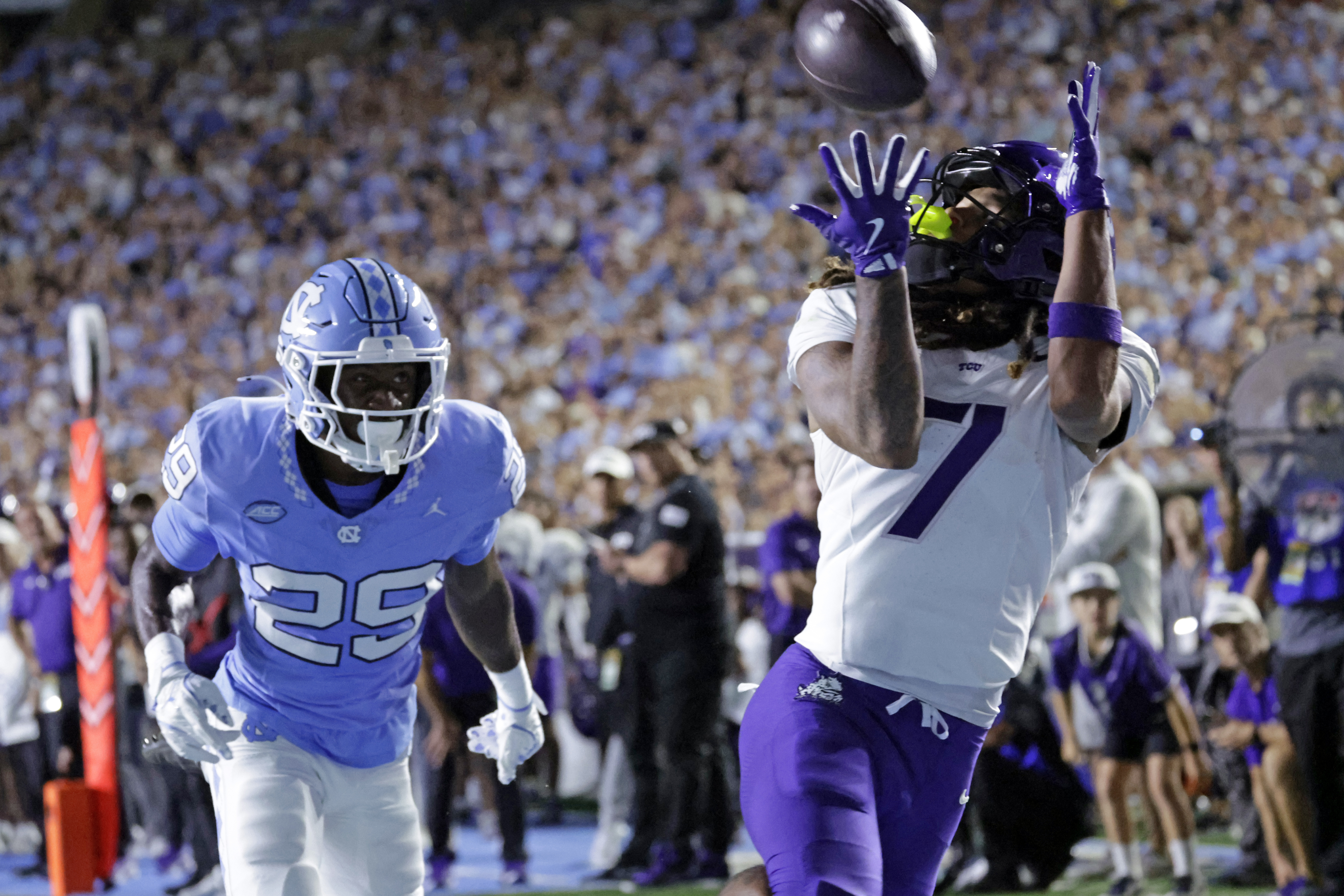 TCU wide receiver Jordan Dwyer (7) hauls in a touchdown pass over North Carolina defensive back Marcus Allen (29) during the first half of an NCAA college football game Monday, Sept. 1, 2025, in Chapel Hill, N.C. 