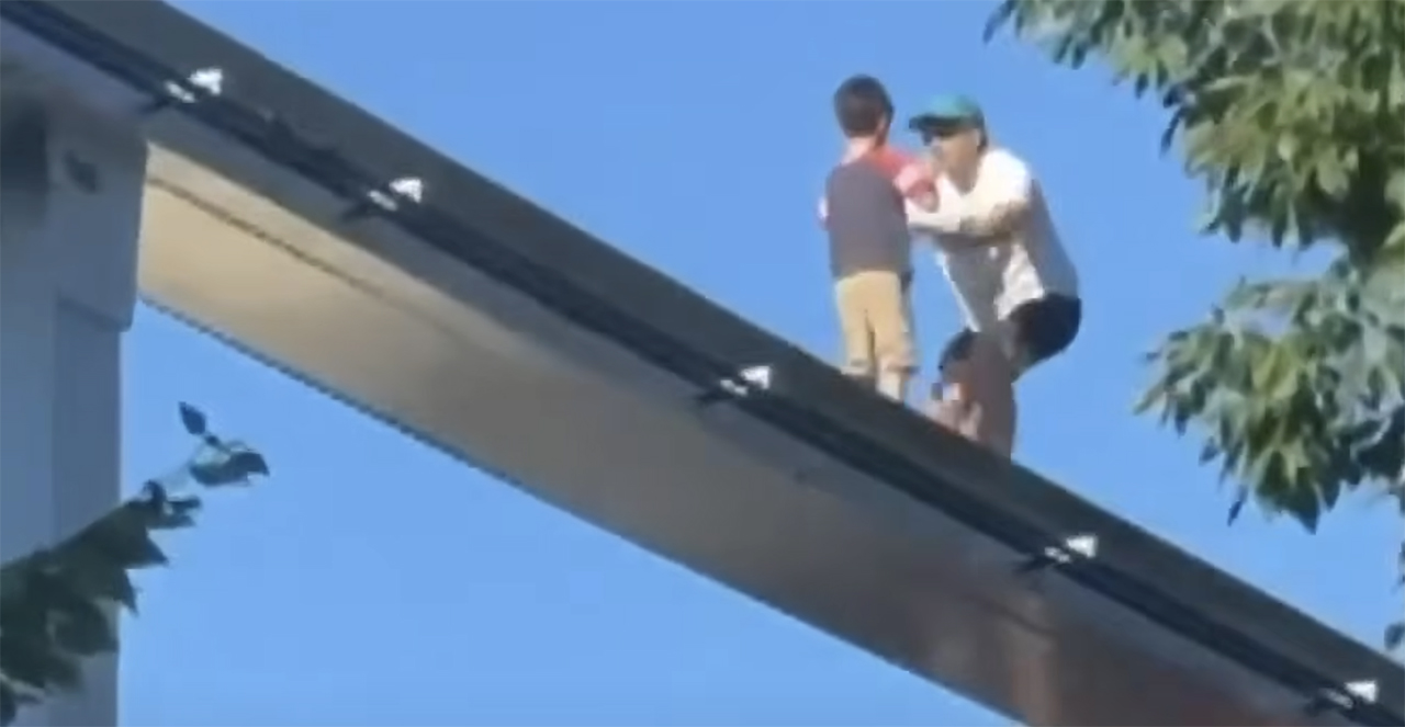 Video shows a man rescuing a lost child found wandering on a monorail line at Hersheypark in Pennsylvania on Saturday.