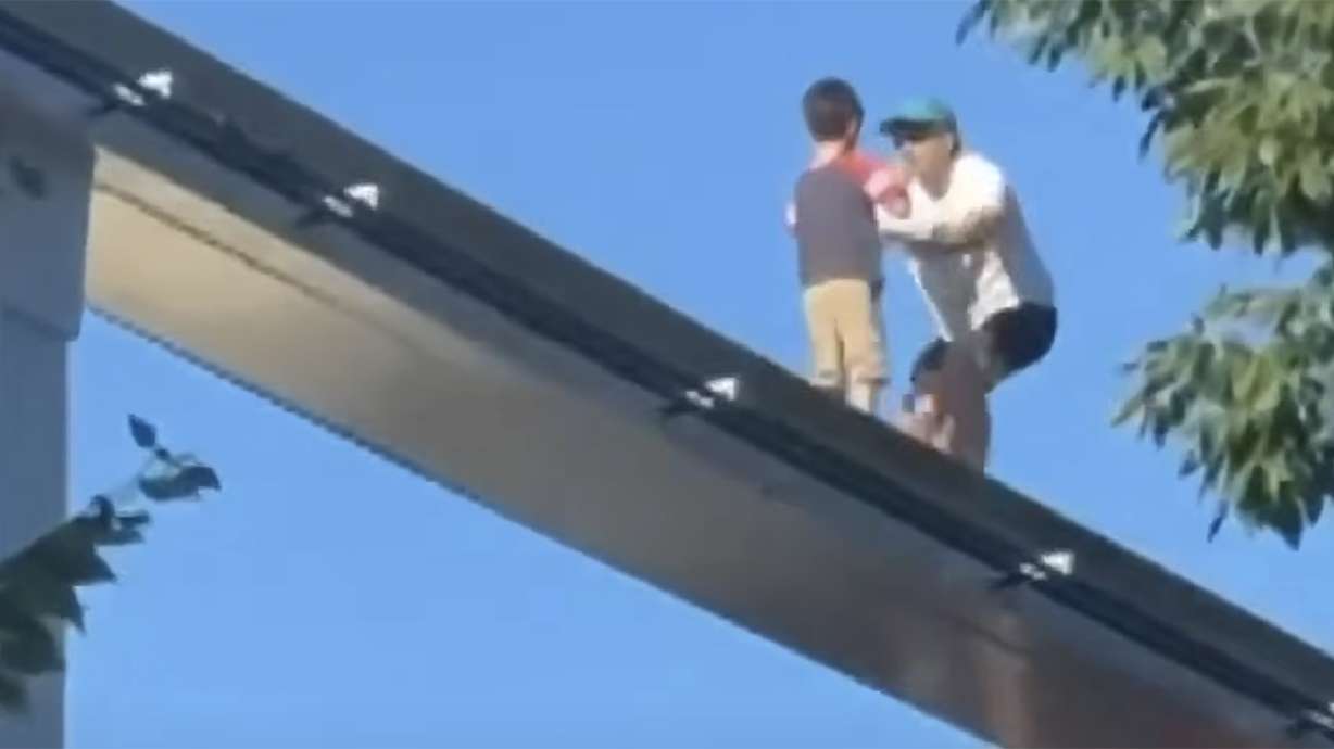 Video shows a man rescuing a lost child found wandering on a monorail line at Hersheypark in Pennsylvania on Saturday.