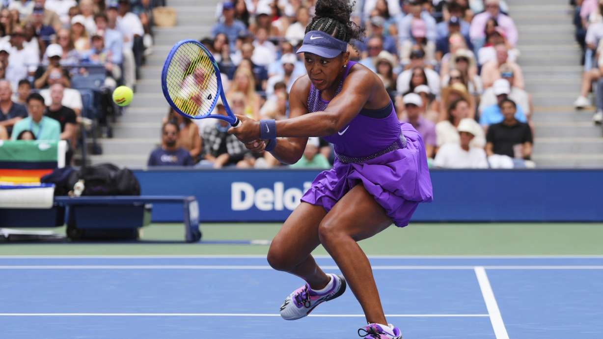 Naomi Osaka, of Japan, returns a shot against Coco Gauff, of the United States, during the fourth round of the US Open tennis championships, Monday, Sept. 1, 2025, in New York.