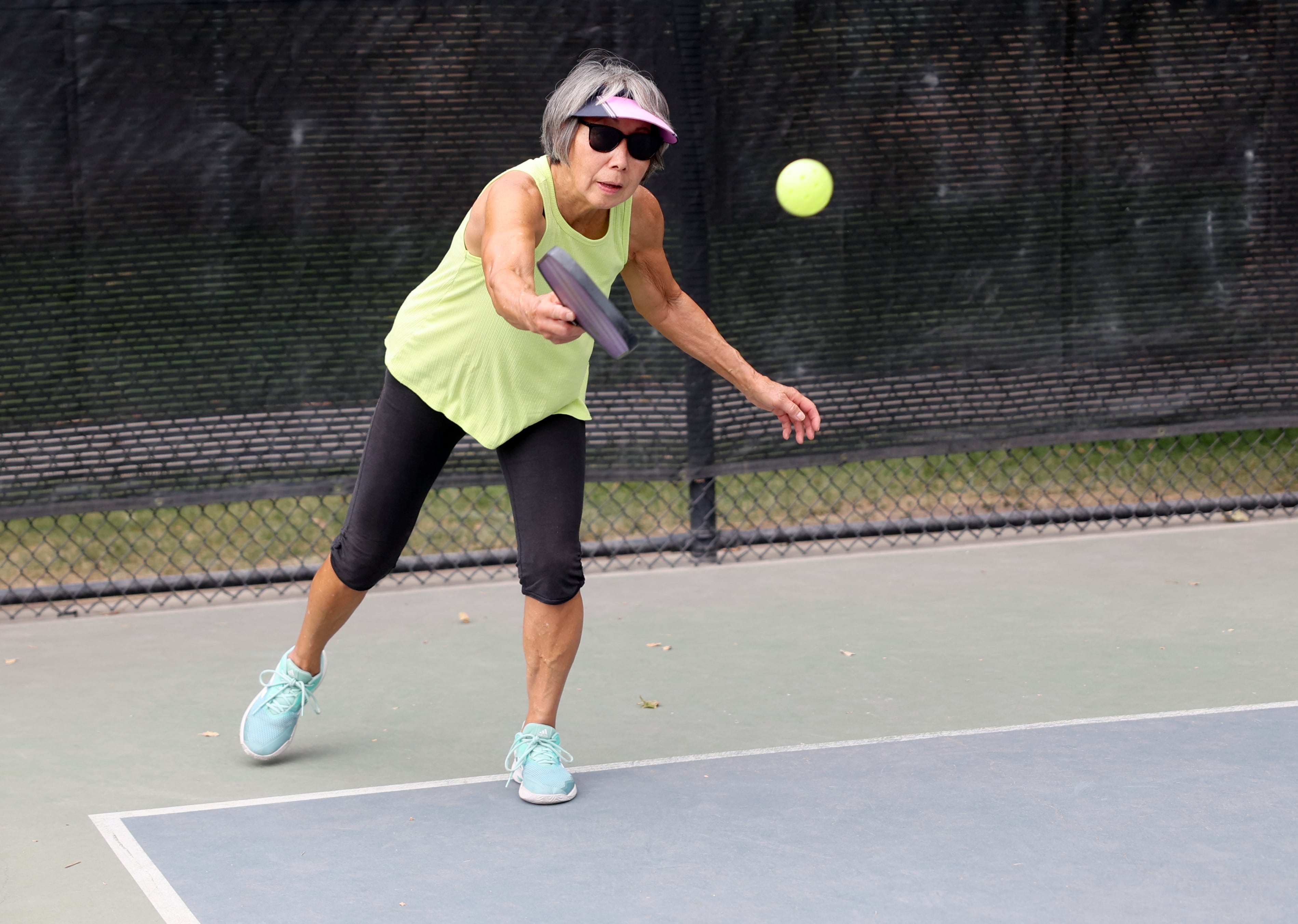 Brenda Koga plays pickleball at Fairmont Park in Salt Lake City on Aug. 26. Koga said most people are injured playing pickleball because of a previous ailment.