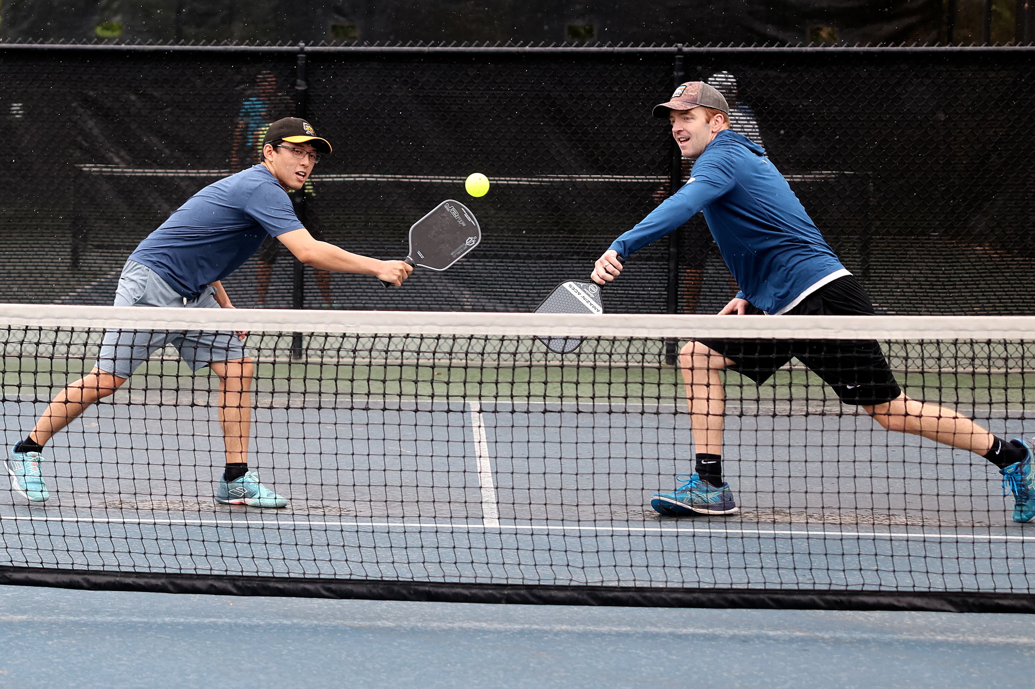 Logan Lee and Drew Artrip play pickleball at Fairmont Park in Salt Lake City on Aug. 26. A new study showed sprains and strains are the most common injuries among pickleball players 18 to 34 years old.