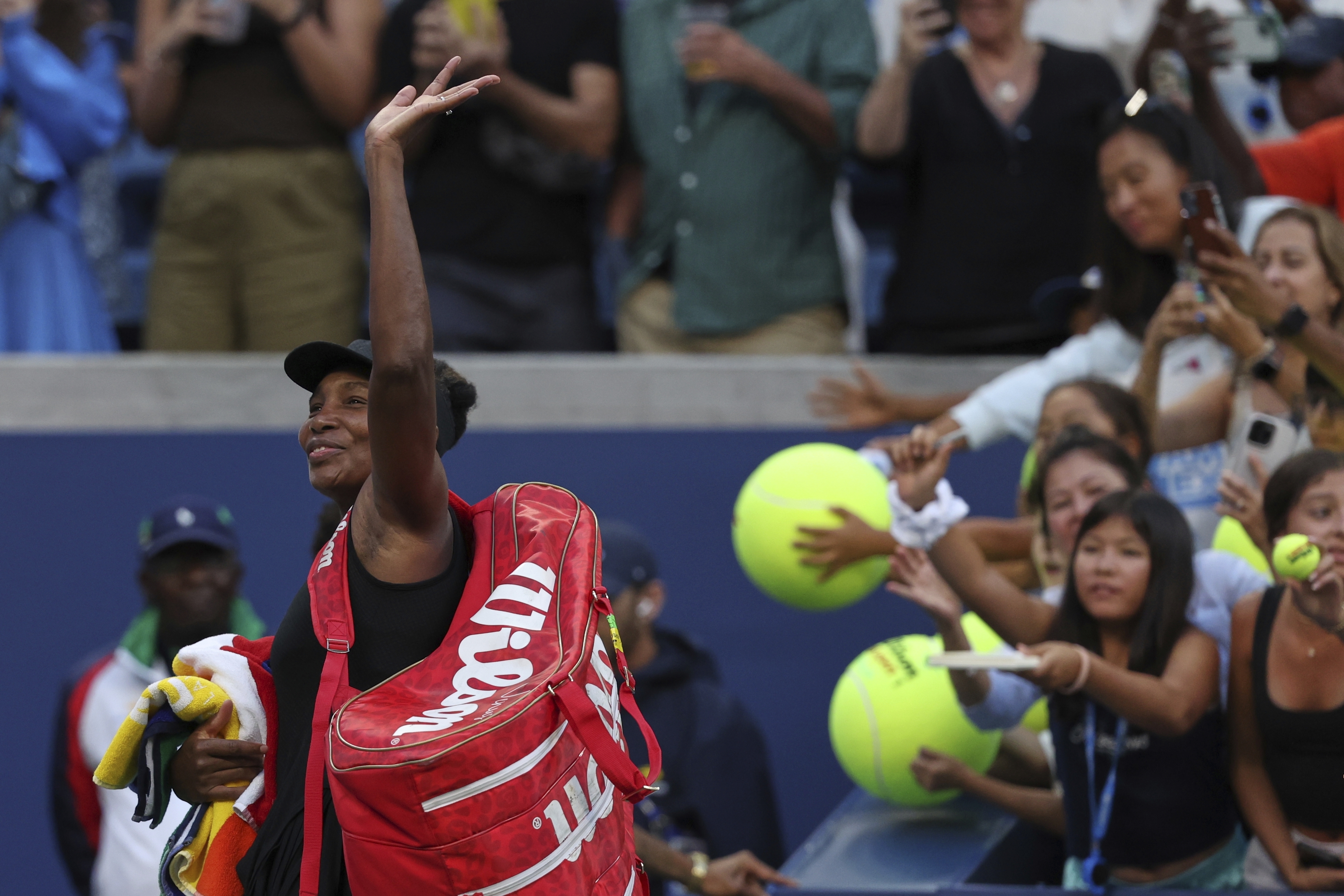 Venus Williams, of the United States, acknowledges the crowd after losing quarterfinal doubles match with parter Leylah Fernandez, of Canada, at the U.S. Open tennis championships, Tuesday, Sept. 2, 2025, in New York.