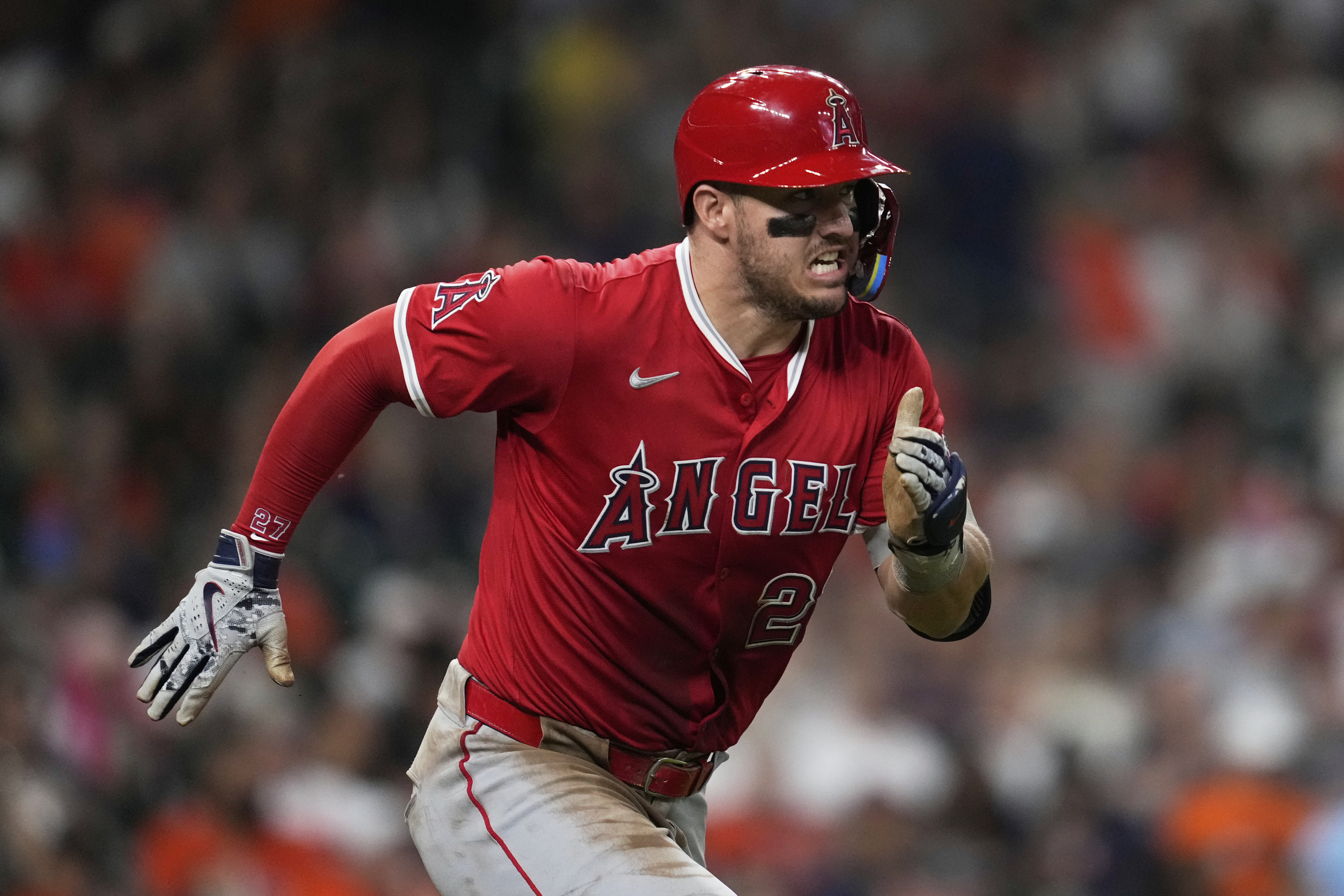 Los Angeles Angels designated hitter Mike Trout runs to first as he grounds out during the third inning of a baseball game against the Houston Astros in Houston, Sunday, Aug. 31, 2025. 
