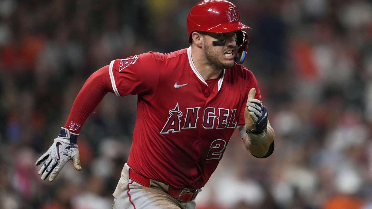 Los Angeles Angels designated hitter Mike Trout runs to first as he grounds out during the third inning of a baseball game against the Houston Astros in Houston, Sunday, Aug. 31, 2025.