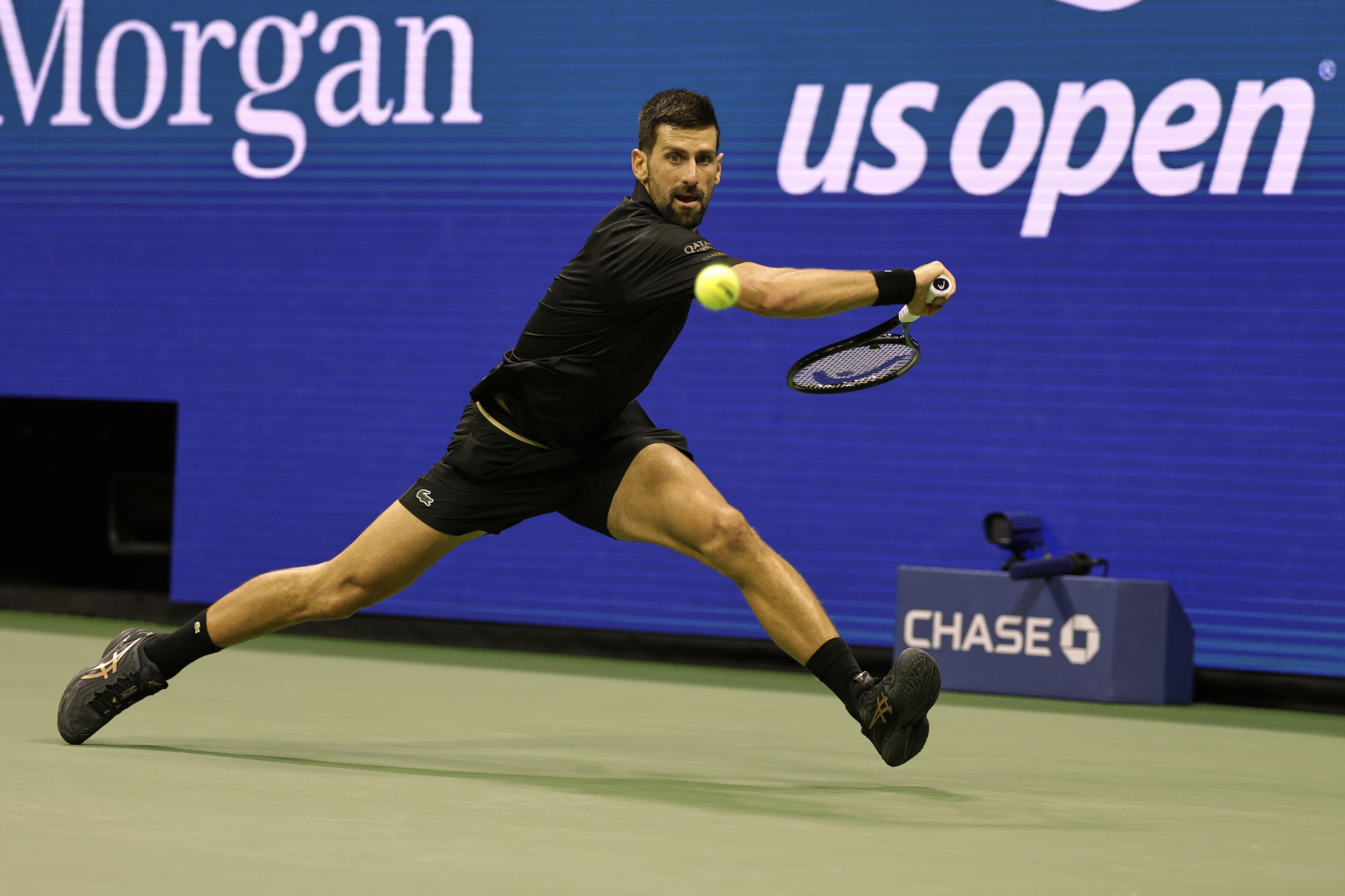 Novak Djokovic, of Serbia, returns a shot against Taylor Fritz, of the United States, during the quarterfinal round of the U.S. Open tennis championships, Tuesday, Sept. 2, 2025, in New York. 