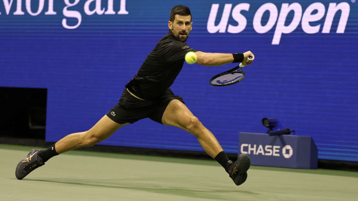 Novak Djokovic, of Serbia, returns a shot against Taylor Fritz, of the United States, during the quarterfinal round of the U.S. Open tennis championships, Tuesday, Sept. 2, 2025, in New York.