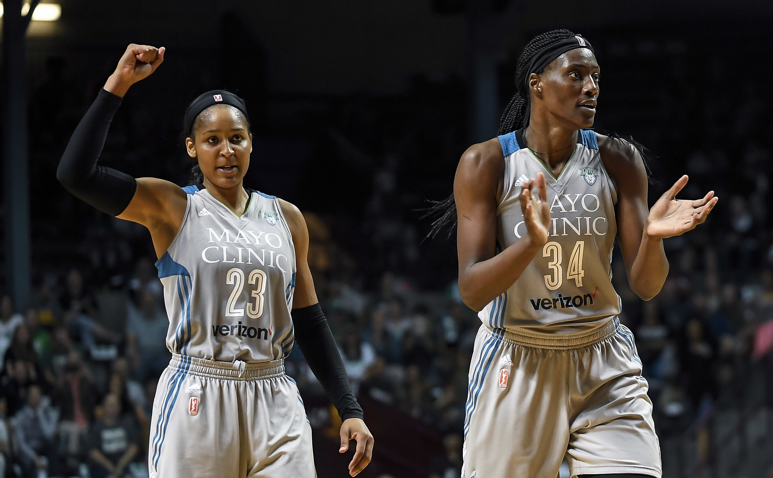 FILE - Minnesota Lynx forward Maya Moore (23) and Minnesota Lynx center Sylvia Fowles (34) celebrate after forcing a Washington Mystics timeout during the second half of a WNBA basketball game, Tuesday, Sept. 12, 2017 in Minneapolis. 