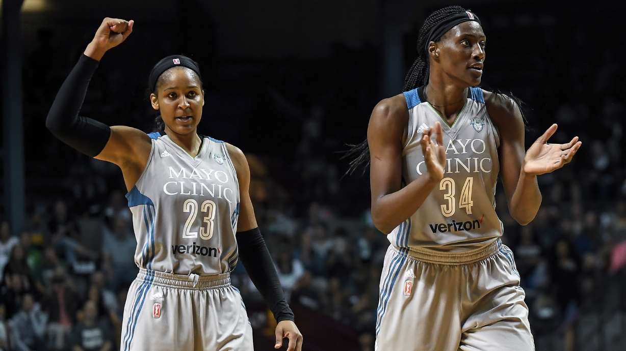 FILE - Minnesota Lynx forward Maya Moore (23) and Minnesota Lynx center Sylvia Fowles (34) celebrate after forcing a Washington Mystics timeout during the second half of a WNBA basketball game, Tuesday, Sept. 12, 2017 in Minneapolis.