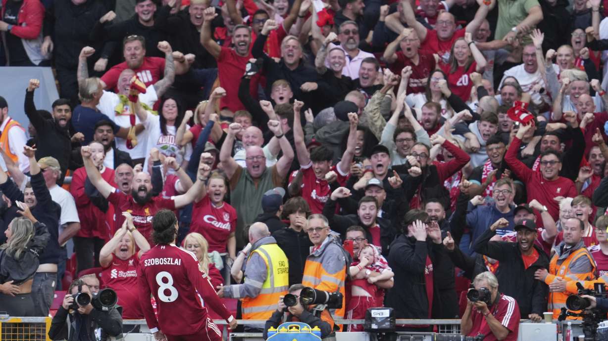 Liverpool's Dominik Szoboszlai celebrates after scoring his sides first goal during the English Premier League soccer match between FC Liverpool and FC Arsenal in Liverpool, England, Sunday, Aug. 31, 2025.