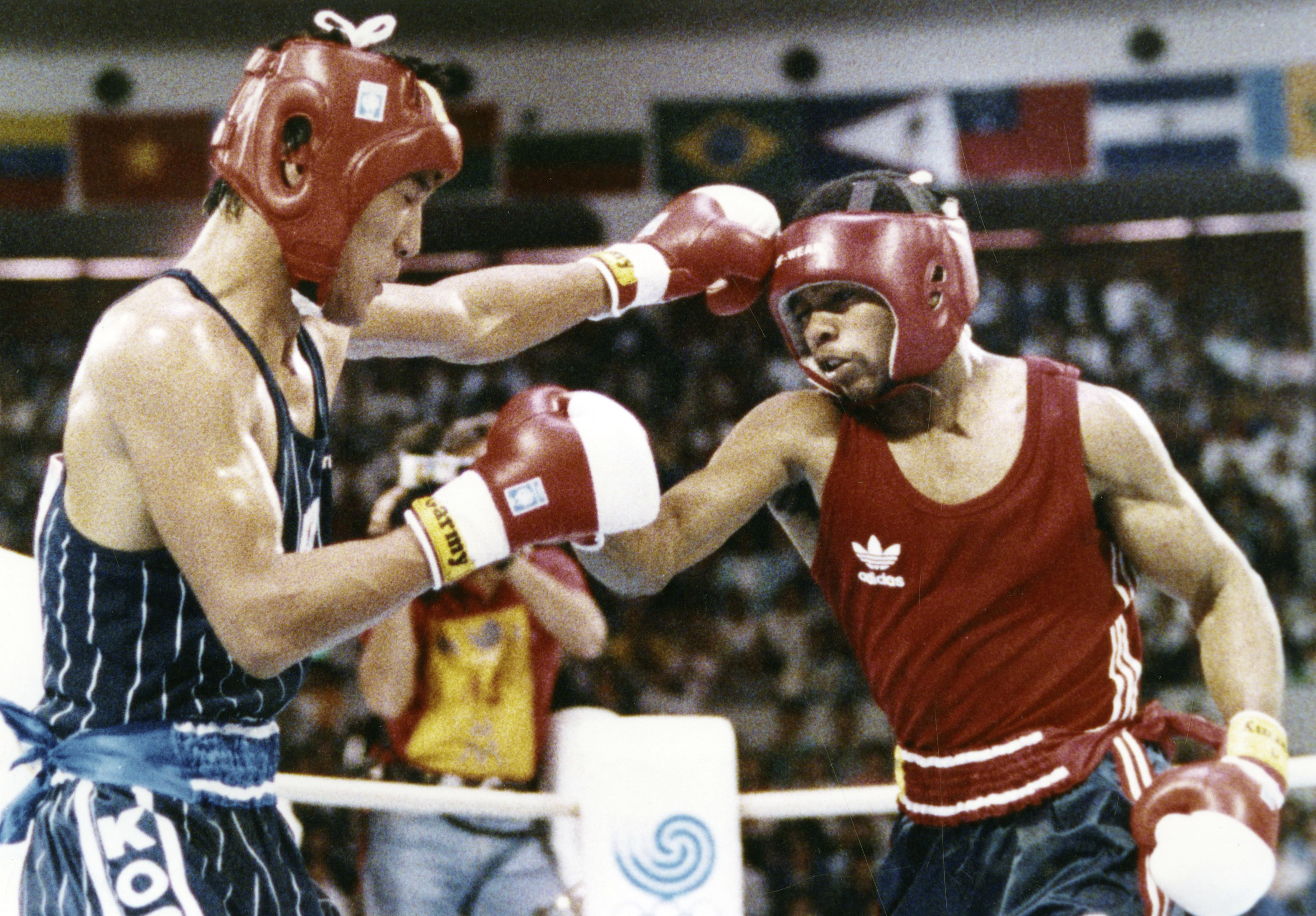 FILE - In this Oct. 2, 1988, file photo, South Korea's Park Si-hun, left, delivers a left jab to Roy Jones Jr. of the United States, during the summer Olympics in Seoul, South Korea.