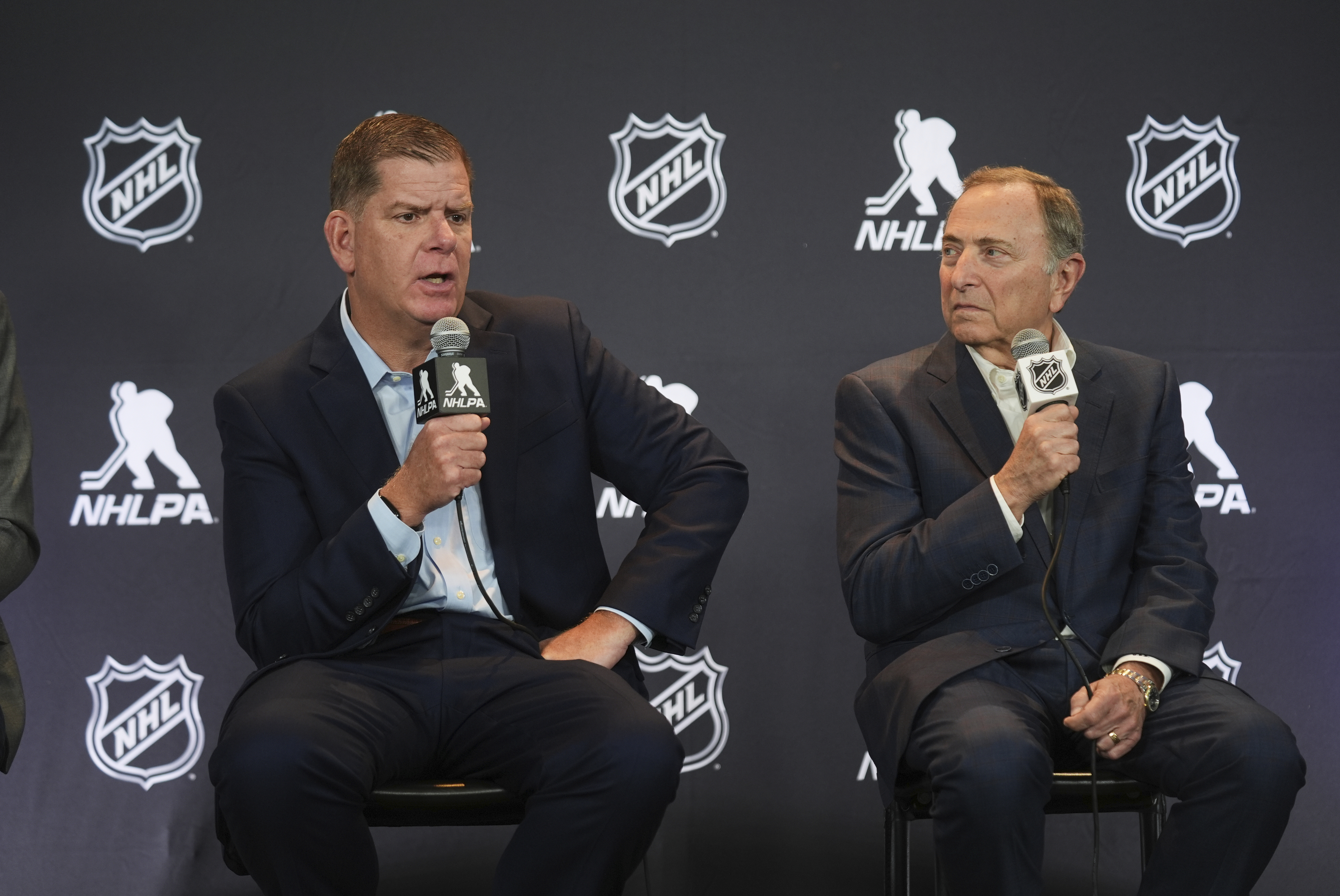 FILE - Marty Walsh, left, NHLPA Executive Director, and Gary Bettman, NHL Commissioner, conduct a joint news conference before the NHL hockey draft on June 27, 2025, in Los Angeles. 