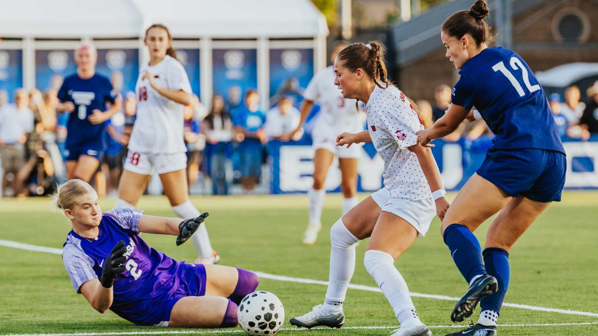 Arkansas' Erin Bailey defends against BYU's Afton Perry while Arkansas goalkeeper Keegan Smith makes a save during the No. 13 Razorbacks' 1-0 win over No. 13 BYU, Tuesday, Sept. 2, 2025 at South Field in Provo.