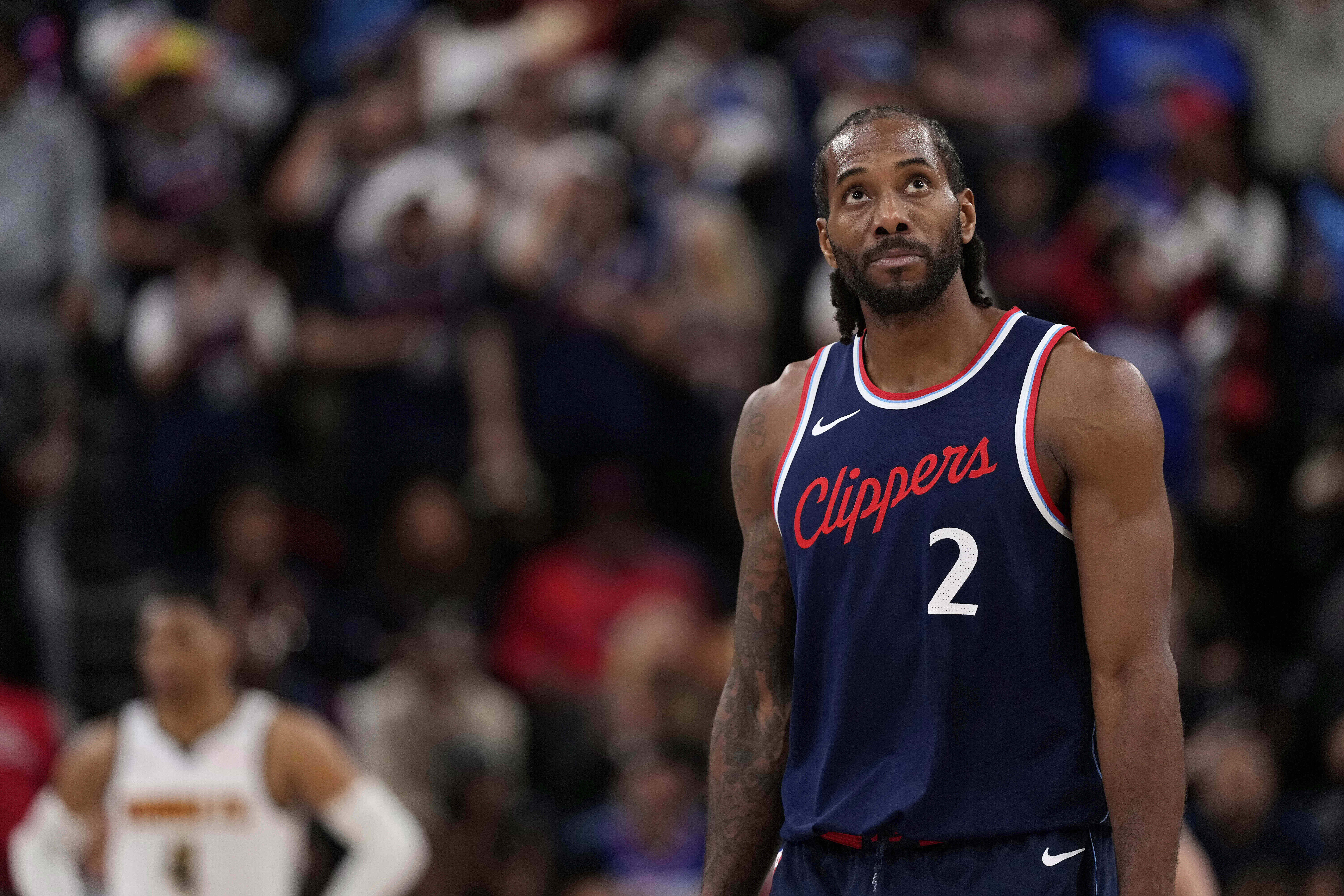 FILE - Los Angeles Clippers forward Kawhi Leonard, right, looks toward the scoreboard during the second half of an NBA basketball game, May 1, 2025, in Inglewood, Calif. 