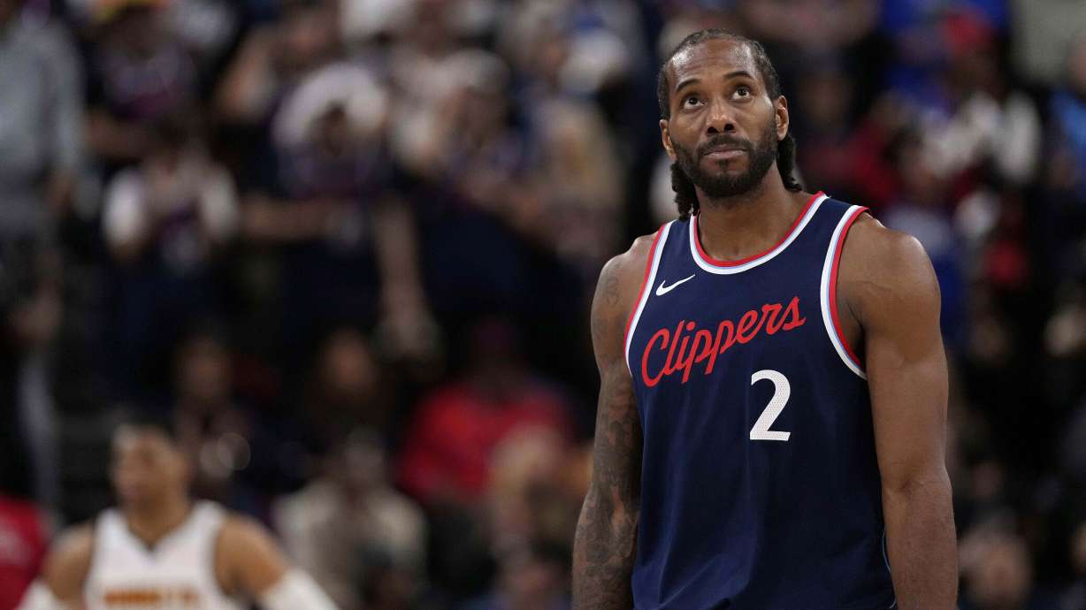 FILE - Los Angeles Clippers forward Kawhi Leonard, right, looks toward the scoreboard during the second half of an NBA basketball game, May 1, 2025, in Inglewood, Calif.