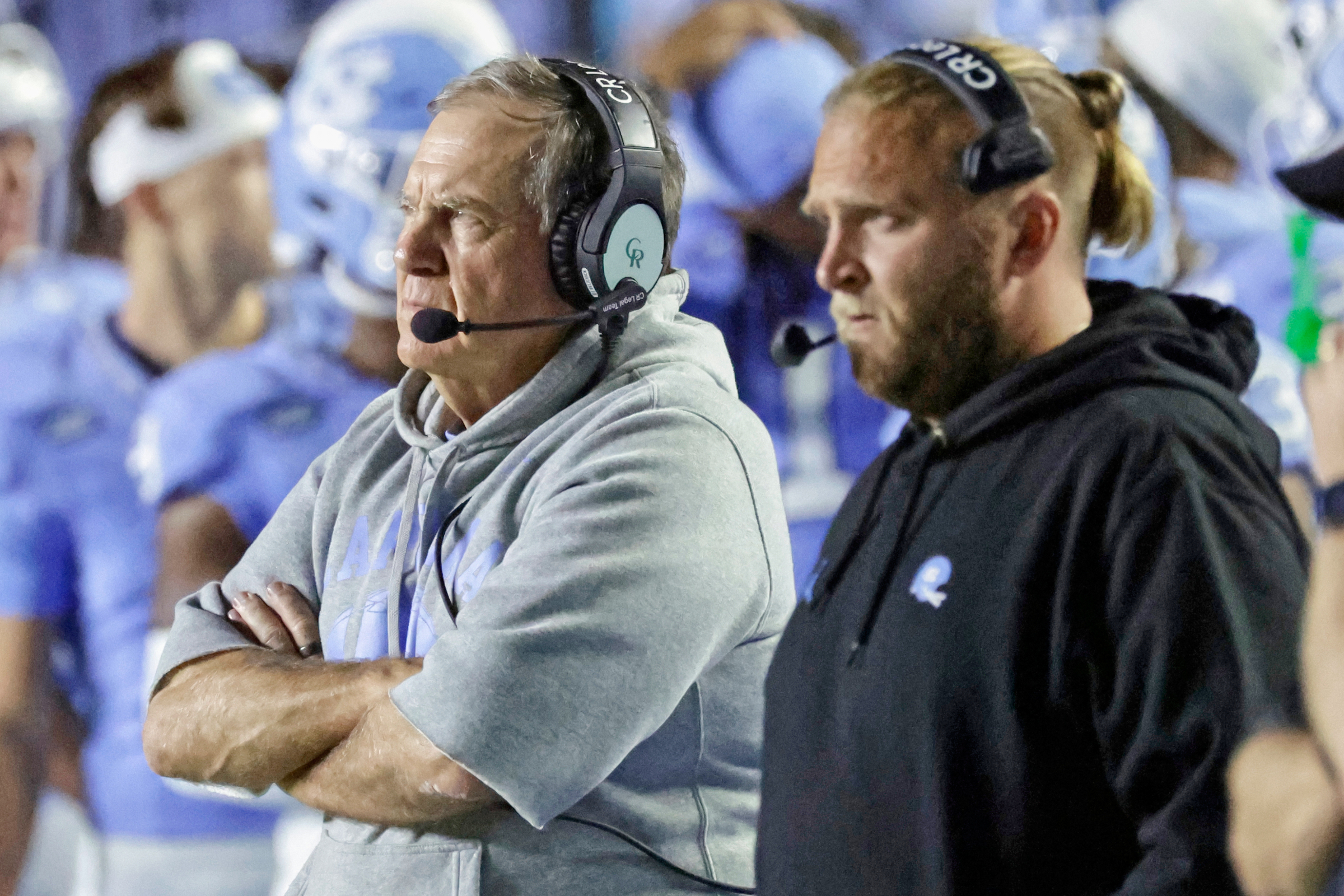 North Carolina head coach Bill Belichick, left, and his son, Steve Belicheck, right, the defensive coordinator, watch in the closing minutes of the second half of an NCAA college football game against TCU, Monday, Sept. 1, 2025, in Chapel Hill, N.C. 