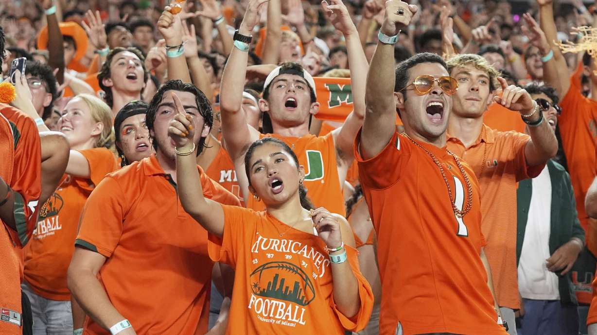 Miami fans cheer during the second half of an NCAA college football game against Notre Dame, Sunday, Aug. 31, 2025, in Miami Gardens, Fla.