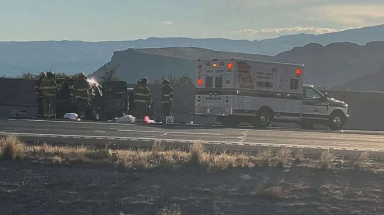 First responders work at the scene of a fatal crash in St. George, Sunday.