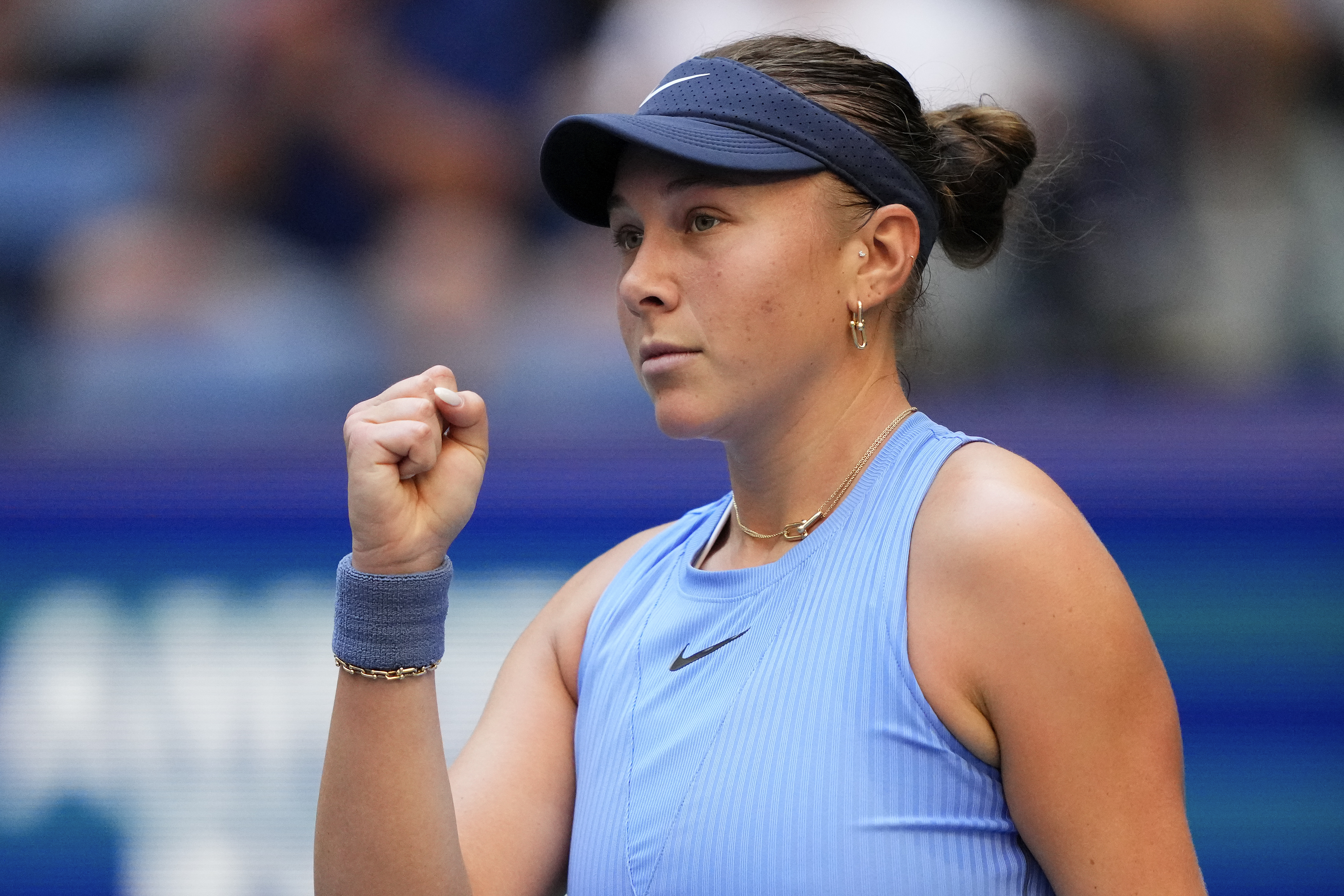 Amanda Anisimova, of the United States, reacts after scoring a point against Iga Swiatek, of Poland, during the quarterfinal round of the U.S. Open tennis championships, Wednesday, Sept. 3, 2025, in New York. 