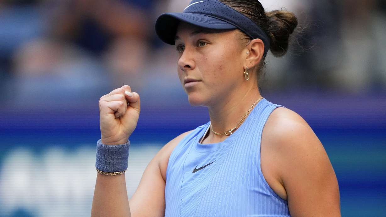 Amanda Anisimova, of the United States, reacts after scoring a point against Iga Swiatek, of Poland, during the quarterfinal round of the U.S. Open tennis championships, Wednesday, Sept. 3, 2025, in New York.