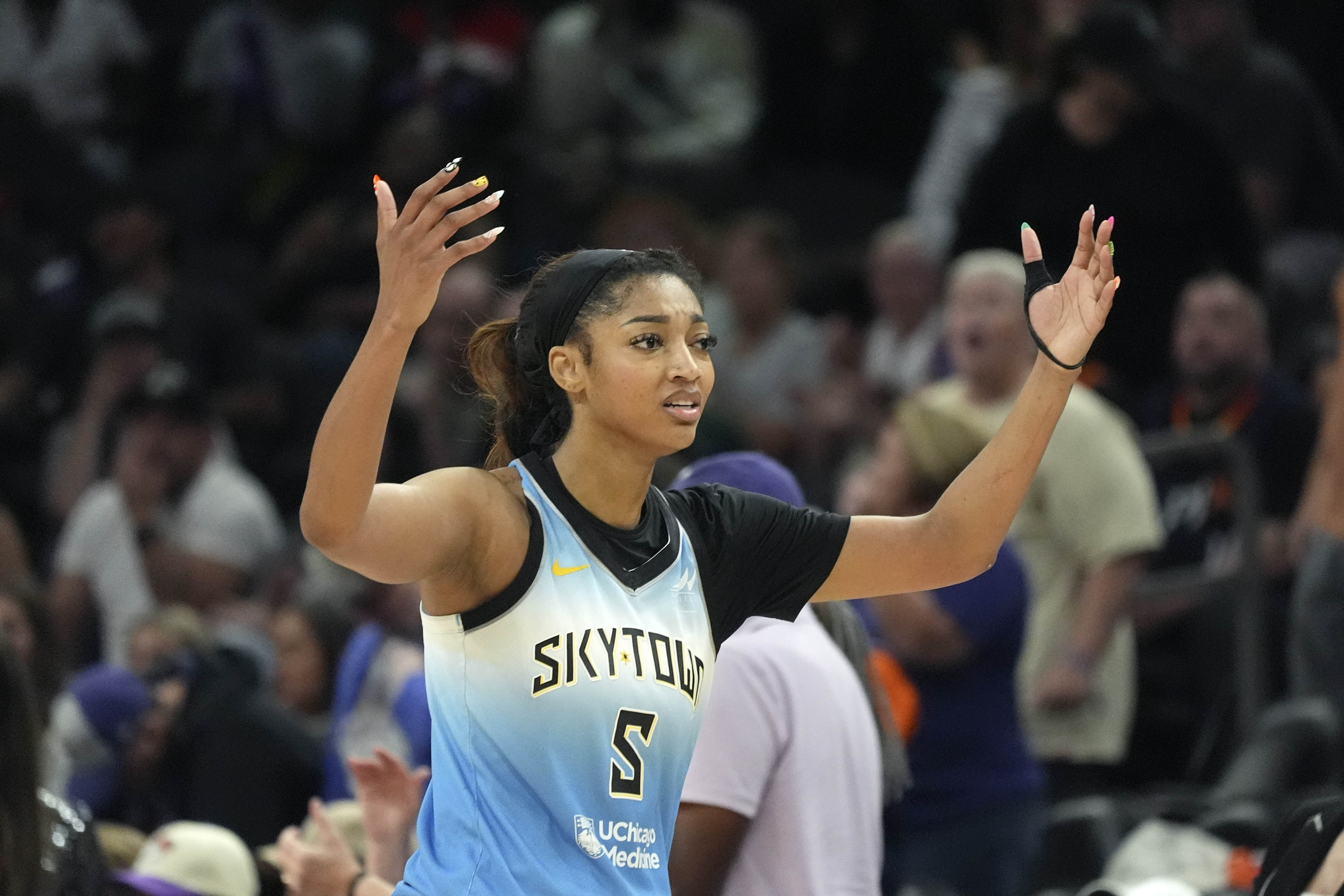 Chicago Sky forward Angel Reese walks to the bench during the second half of a WNBA basketball game against the Phoenix Mercury Thursday, Aug. 28, 2025, in Phoenix. 