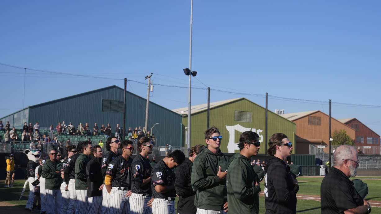 FILE - Oakland Ballers players stand during the national anthem before a Pioneer League baseball game against the Rocky Mountain Vibes in Oakland, Calif., July 10, 2025.