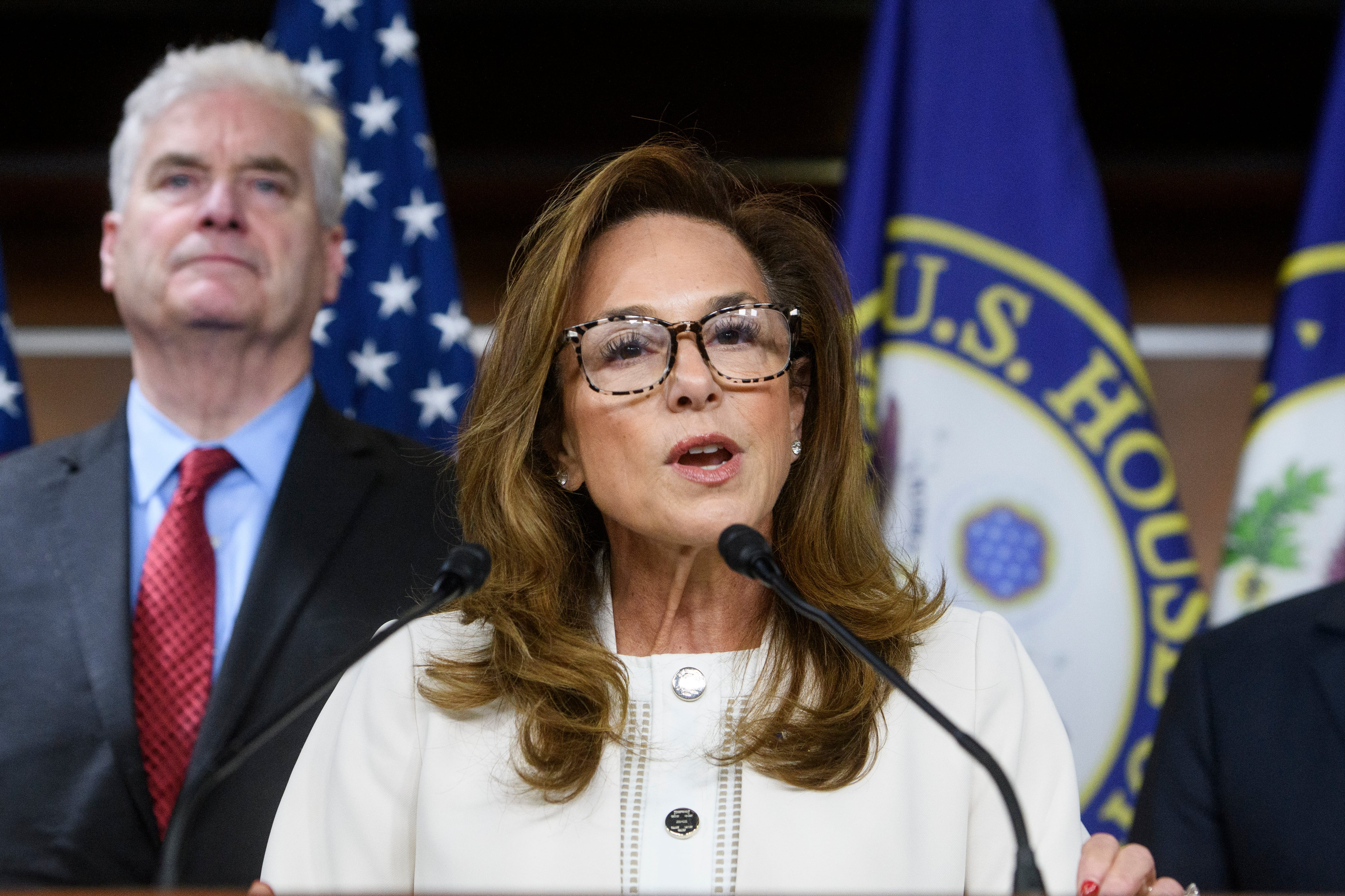 House Republican Conference Chairwoman Lisa McClain, R-Mich., is joined by House Majority Whip Tom Emmer, R-Minn., left, as she speaks during a news conference at the Capitol, May 6, in Washington.