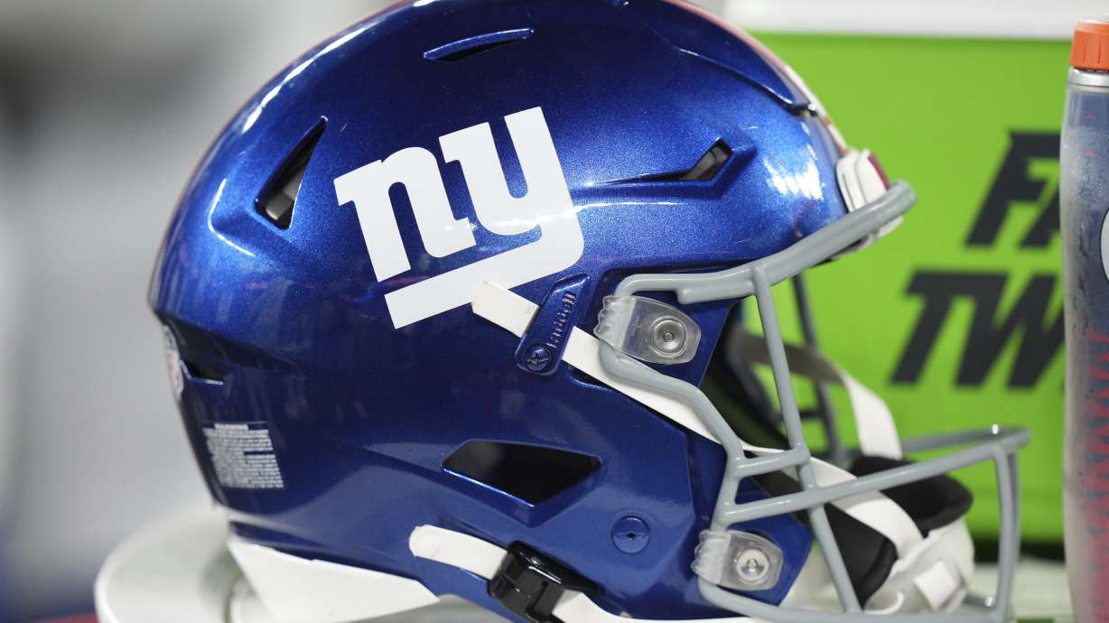 FILE - A New York Giants helmet sits on the sidelines during an NFL preseason football game against the New England Patriots, Aug. 21, 2025, in East Rutherford, NJ.