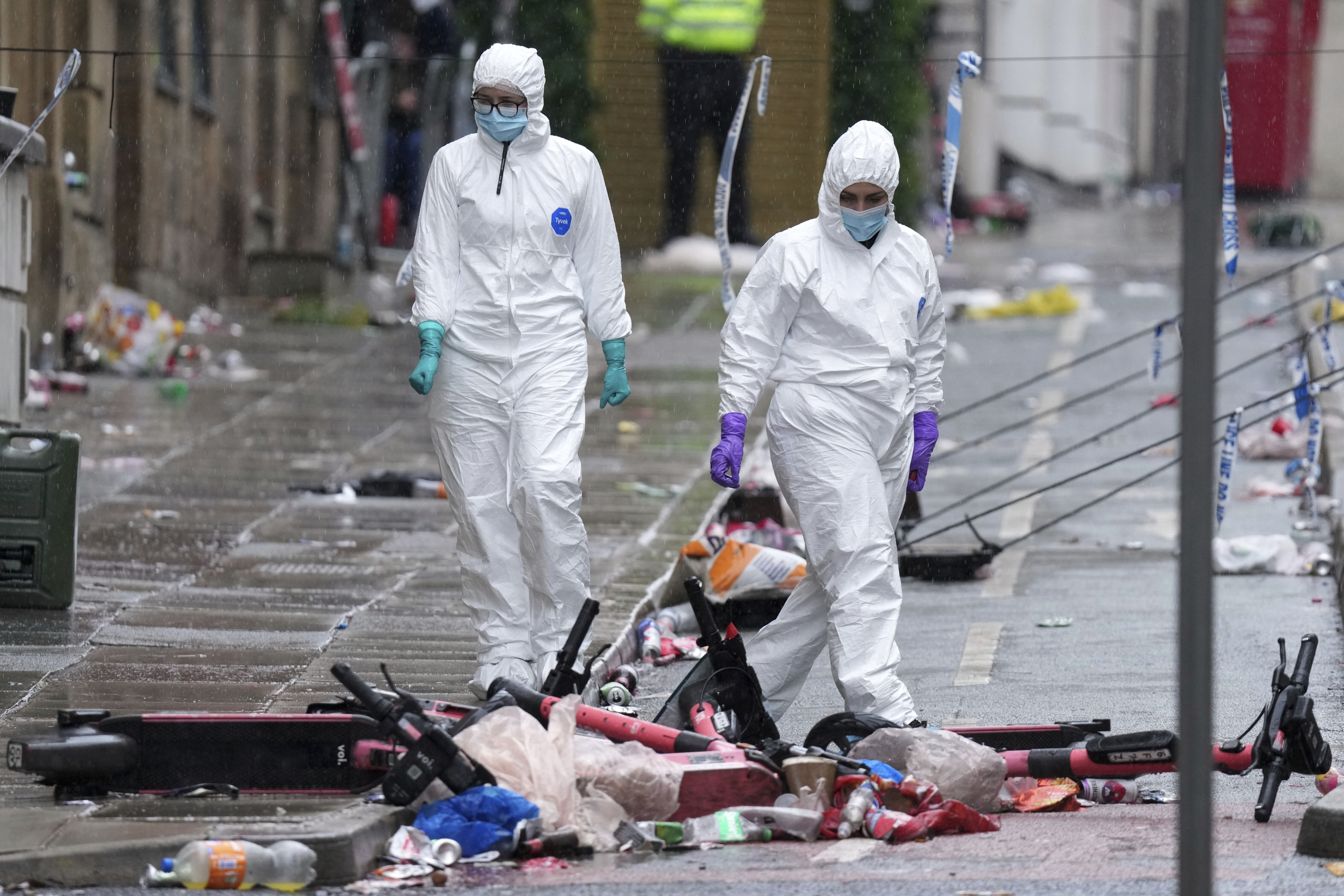 FILE - Forensic officers examine the site where a 53-year-old British man plowed a minivan into a crowd of Liverpool soccer fans who were celebrating the city's Premier League championship Monday, injuring more than 45 people in Liverpool, England, Tuesday, May 27, 2025. 
