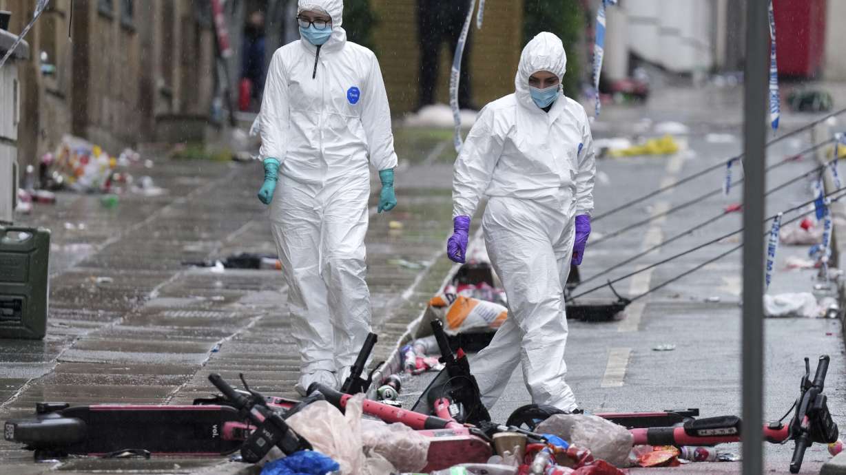 FILE - Forensic officers examine the site where a 53-year-old British man plowed a minivan into a crowd of Liverpool soccer fans who were celebrating the city's Premier League championship Monday, injuring more than 45 people in Liverpool, England, Tuesday, May 27, 2025.