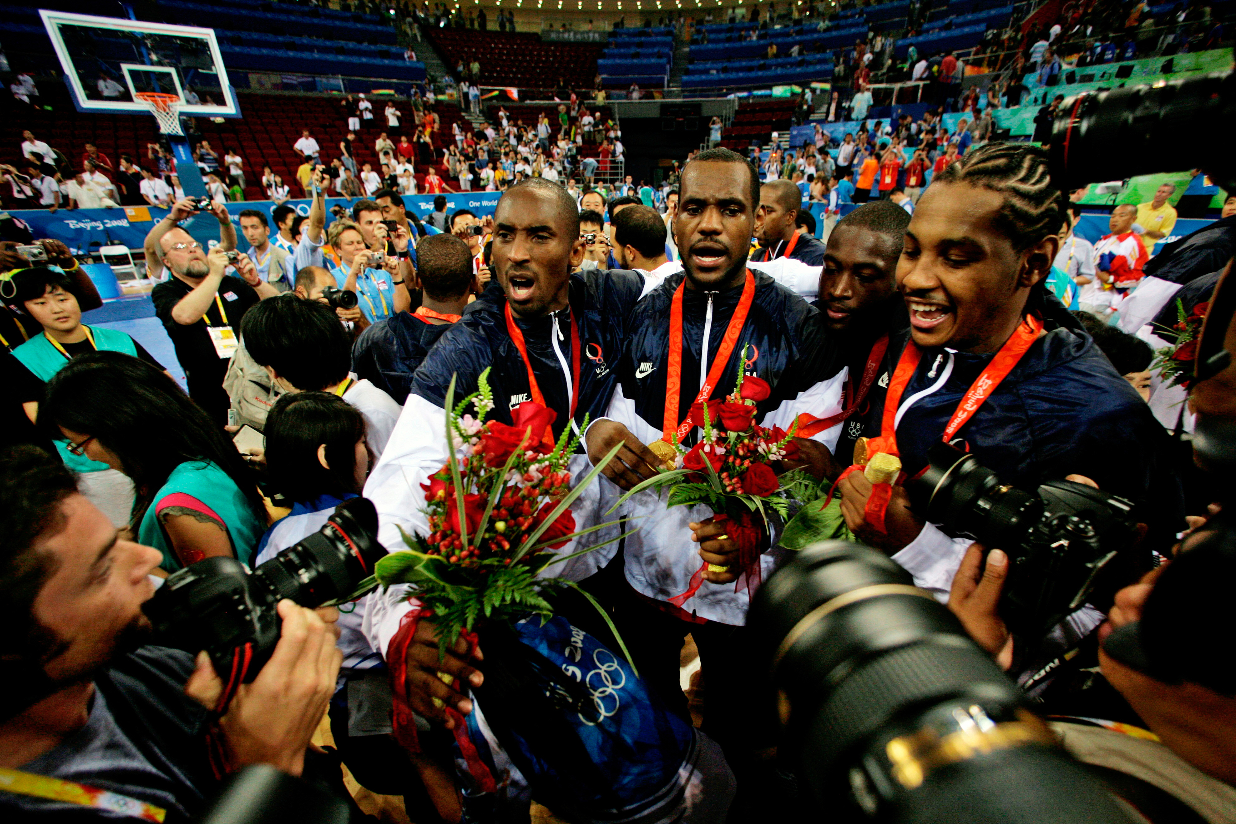 FILE - USA's, from left, Kobe Bryant, LeBron James, Dwyane Wade and Carmelo Anthony face photographers as they celebrate after beating Spain in the men's gold medal basketball game at the 2008 Olympics in Beijing, Aug. 24, 2008. 