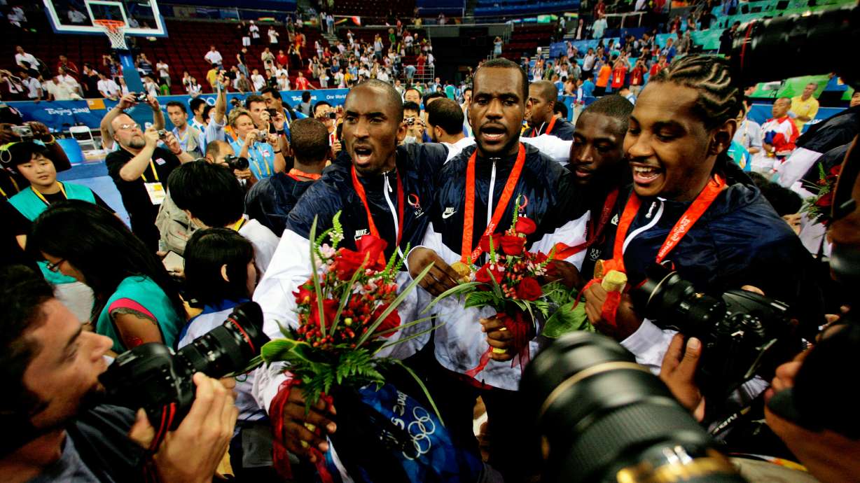 FILE - USA's, from left, Kobe Bryant, LeBron James, Dwyane Wade and Carmelo Anthony face photographers as they celebrate after beating Spain in the men's gold medal basketball game at the 2008 Olympics in Beijing, Aug. 24, 2008.