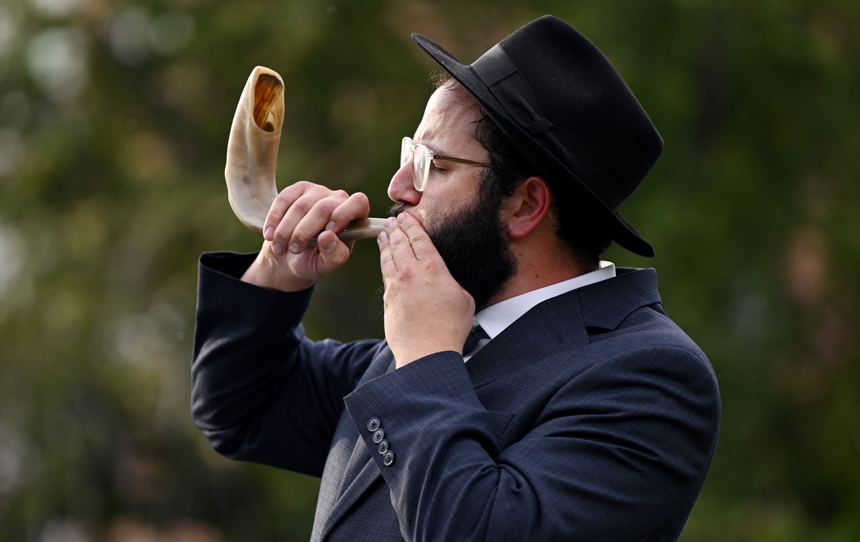 Rabbi Moshe Nigri blows the shofar, the ram's horn, signifying the arrival of God on Rosh Hashanah, at the grand opening of the Mel Meister Chabad Lounge on Wednesday. Nigri called the opening reflects the support for the Jewish community on campus and in Salt Lake City.