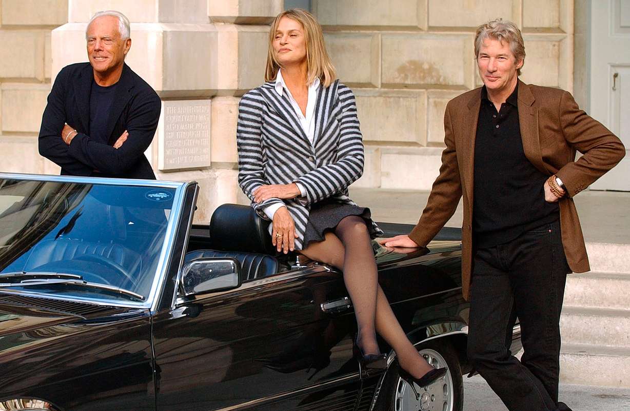 Richard Gere and Lauren Hutton with fashion designer Giorgio Armani during a photocall at the Royal Academy of Arts in London, Oct. 14, 2003. Armani used the 1980 film "American Gigolo" as a springboard into Hollywood fashion.