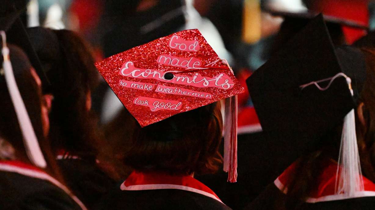 A graduate wears a decorated cap at commencement at the University of Utah in Salt Lake City on May 2, 2024. The Utah Board of Higher Education welcomed a trio of new members to its body Thursday.