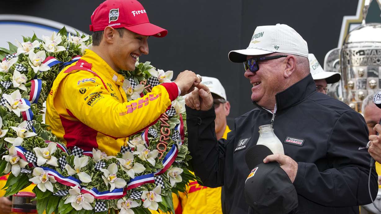 FILE - Car owner Chip Ganassi touches the winner ring as he and Alex Palou, of Spain, celebrate after winning the Indianapolis 500 auto race at Indianapolis Motor Speedway in Indianapolis, Sunday, May 25, 2025.