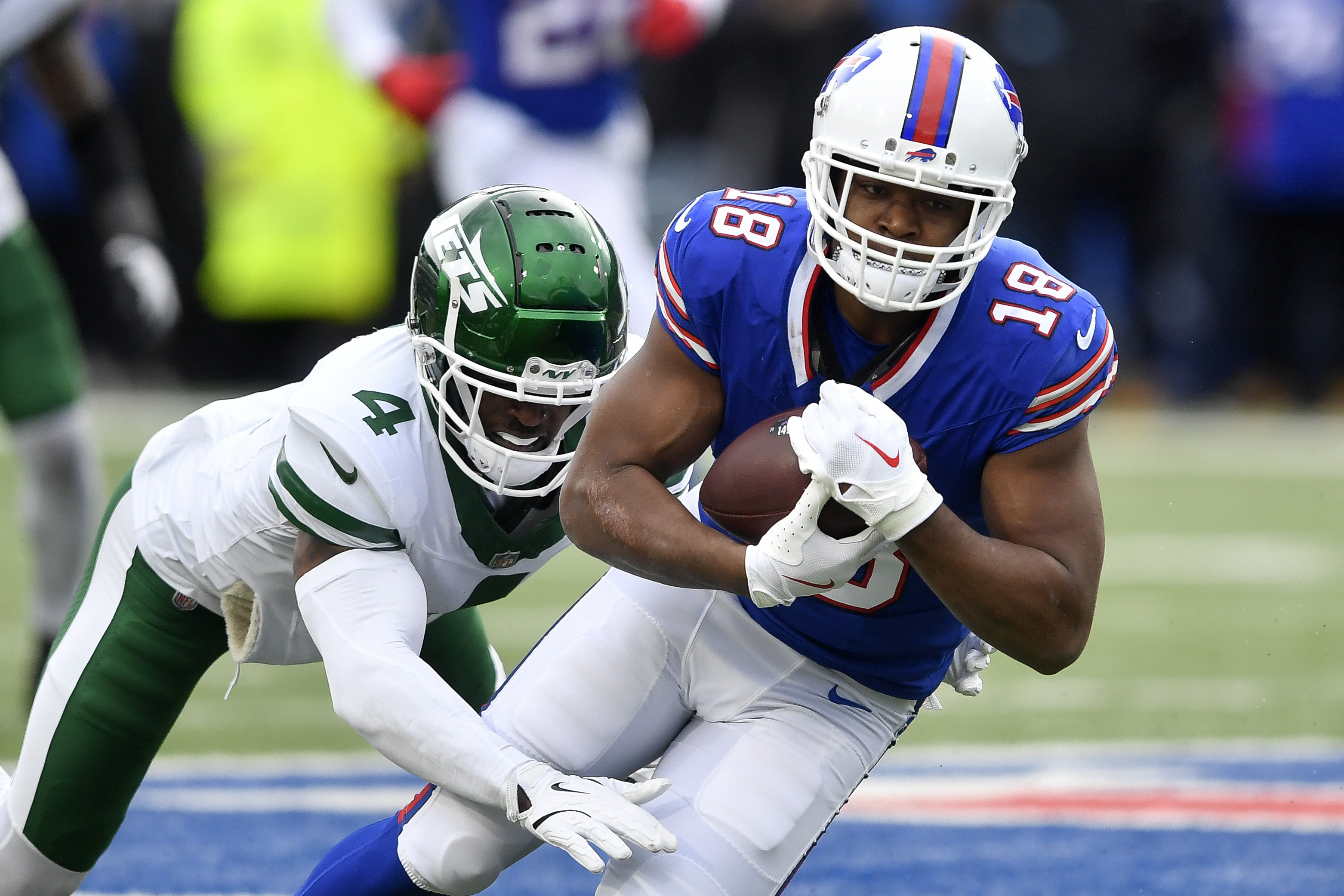 FILE - Buffalo Bills wide receiver Amari Cooper, right, is tackled by New York Jets cornerback D.J. Reed (4) during the first half of an NFL football game in Orchard Park, N.Y., Sunday, Dec. 29, 2024. 