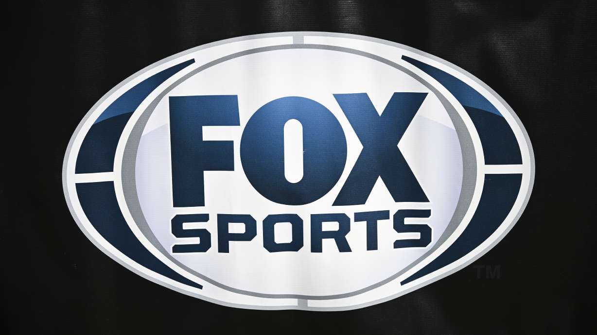 FILE - A FOX Sports banner is viewed behind the end zone before an NFL football game between the Jacksonville Jaguars and the Houston Texans, Dec. 1, 2024, in Jacksonville, Fla.