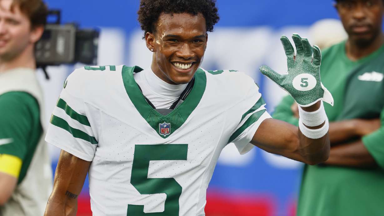 FILE - New York Jets wide receiver Garrett Wilson (5) smiles before playing against the New York Giants in a preseason NFL football game, Saturday, Aug. 16, 2025, in East Rutherford, N.J.