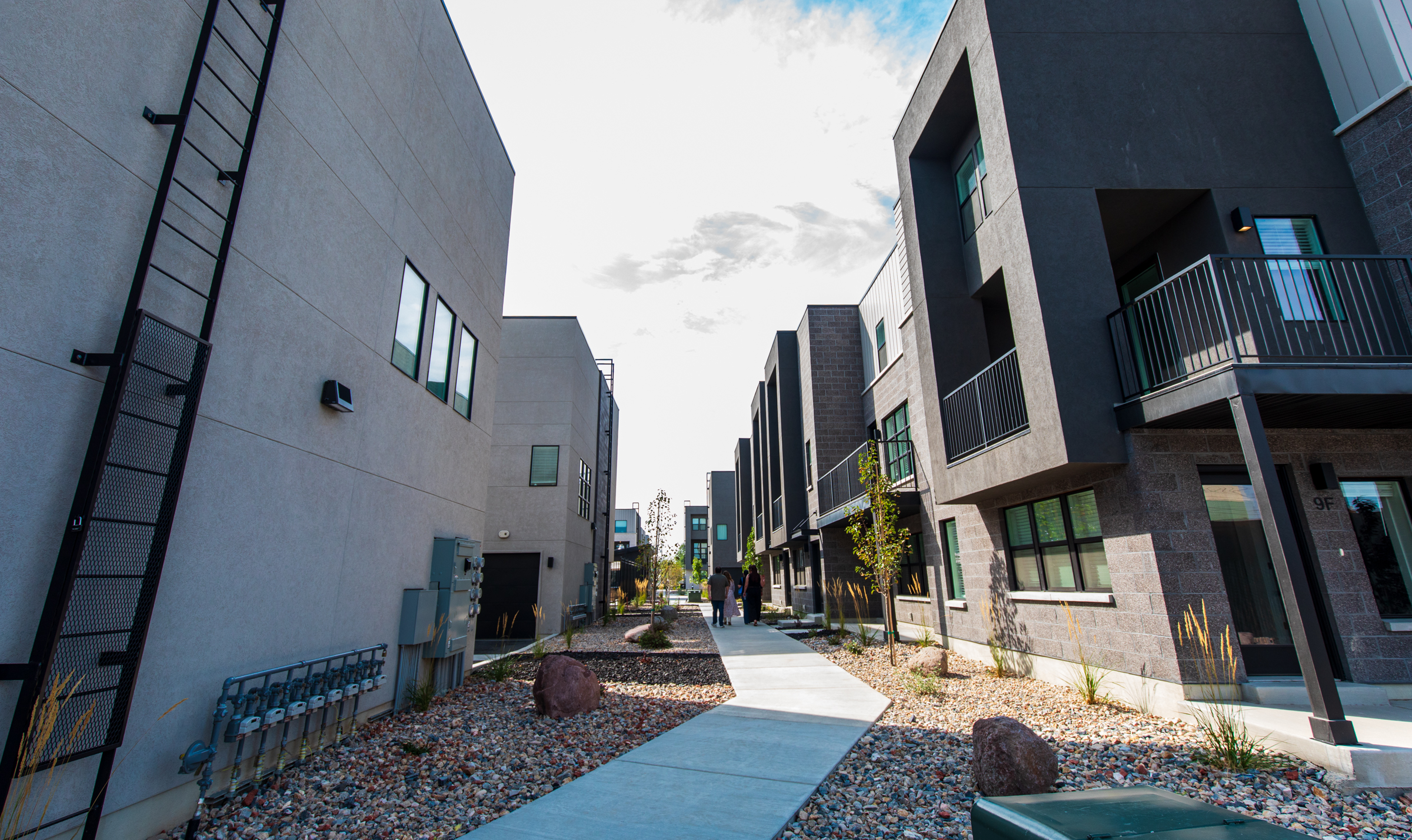 People tour TheYard after a ribbon-cutting ceremony in Salt Lake City on Thursday. About half of the complex's 157 multi-bedroom townhome units are now open, while the rest will open over the next several months.