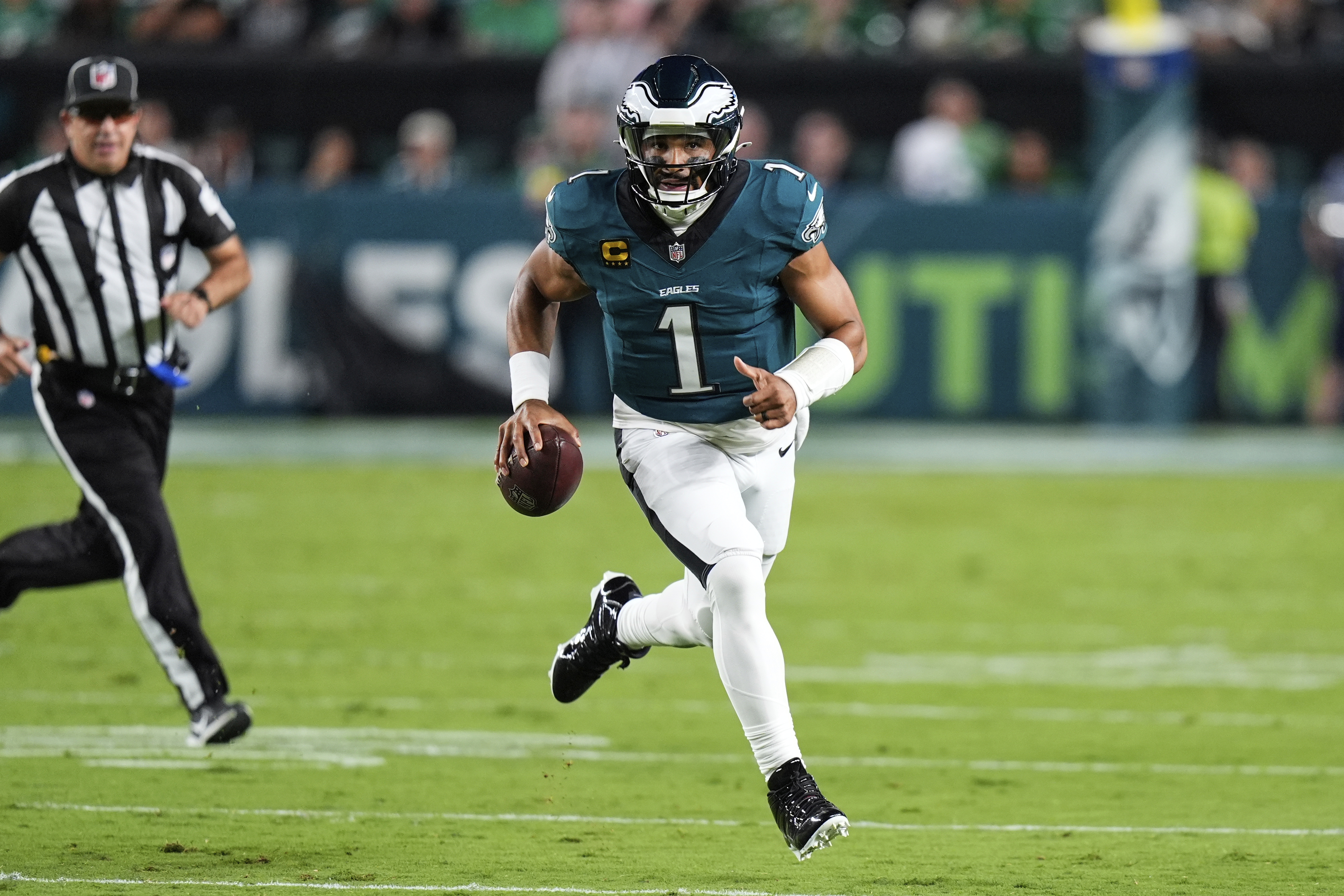 Philadelphia Eagles quarterback Jalen Hurts (1) runs the ball in the first half of an NFL football game against the Dallas Cowboys Thursday, Sept. 4, 2025, in Philadelphia. 