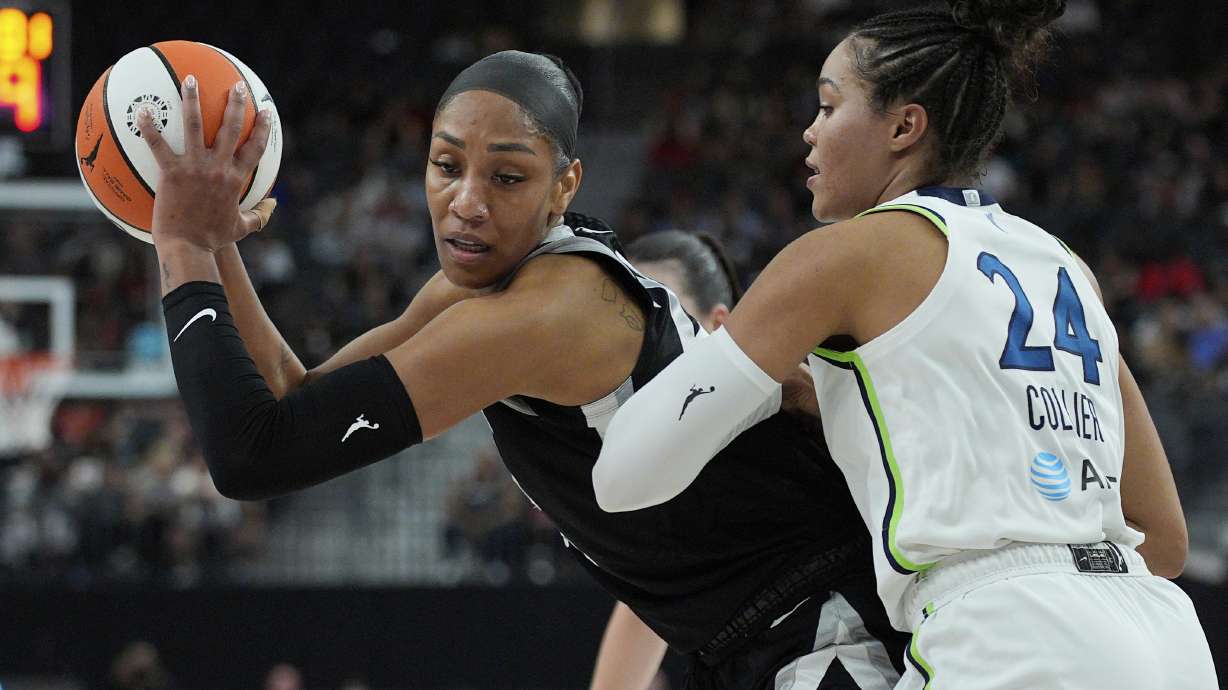 Las Vegas Aces center A'ja Wilson, left, drives against Minnesota Lynx forward Napheesa Collier (24) during the first half of a WNBA basketball game Thursday, Sept. 4, 2025, in Las Vegas.