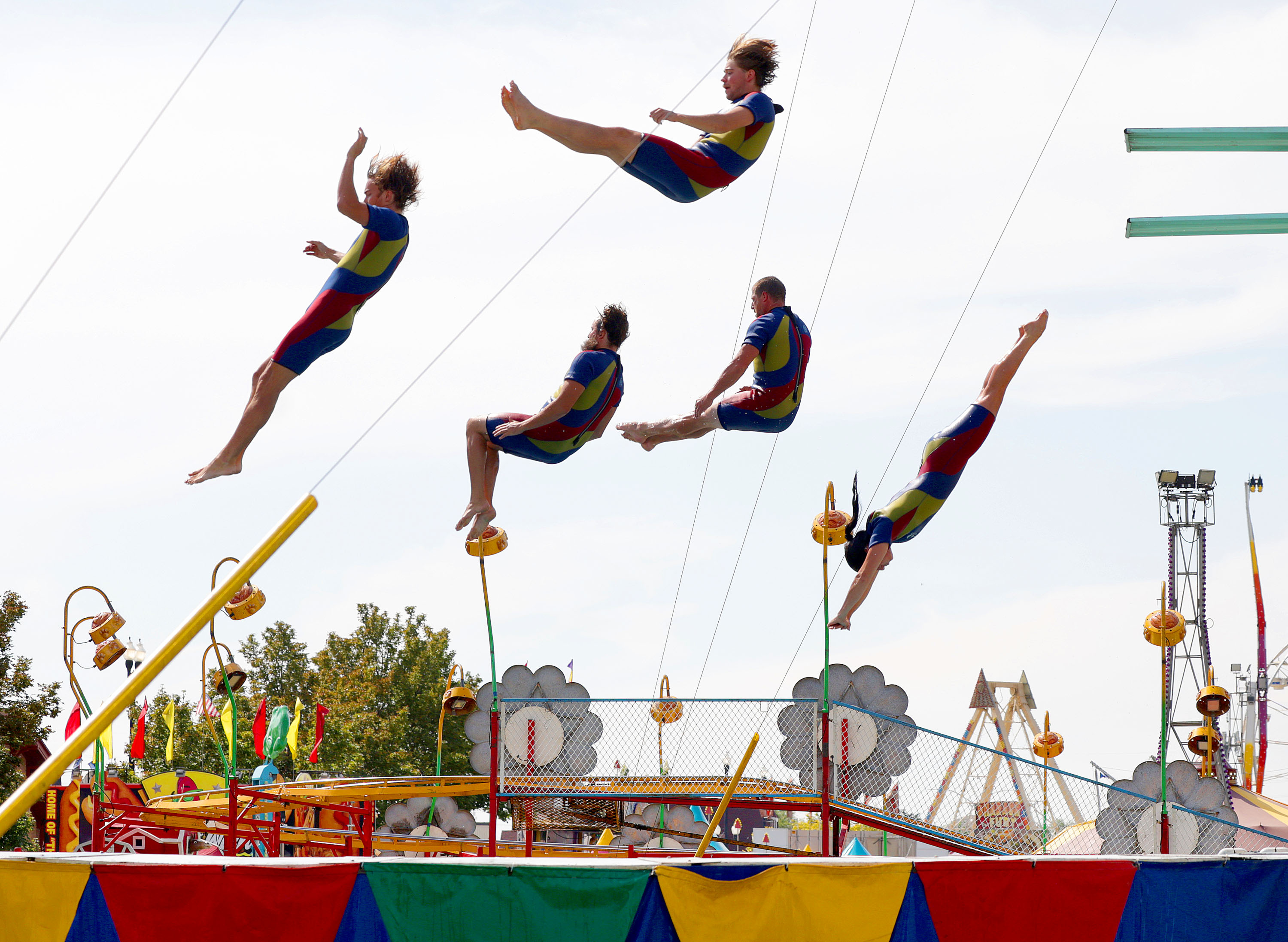 The Flying Fools High Dive team performs during the first day of the Utah State Fair at the Utah State Fairpark in Salt Lake City on Thursday.