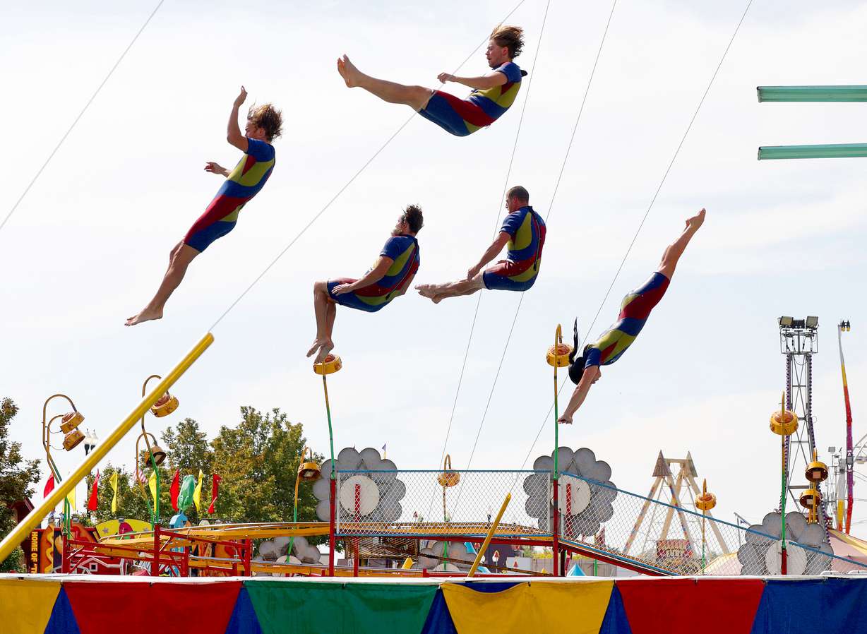 The Flying Fools High Dive team performs during the first day of the Utah State Fair at the Utah State Fairpark in Salt Lake City on Thursday.
