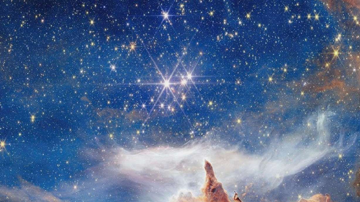 This image provided by NASA on Friday shows a scene of star birth in Pismis 24, a young star cluster about 5,500 light-years from Earth in the constellation Scorpius taken by NASA's Webb Space Telescope.