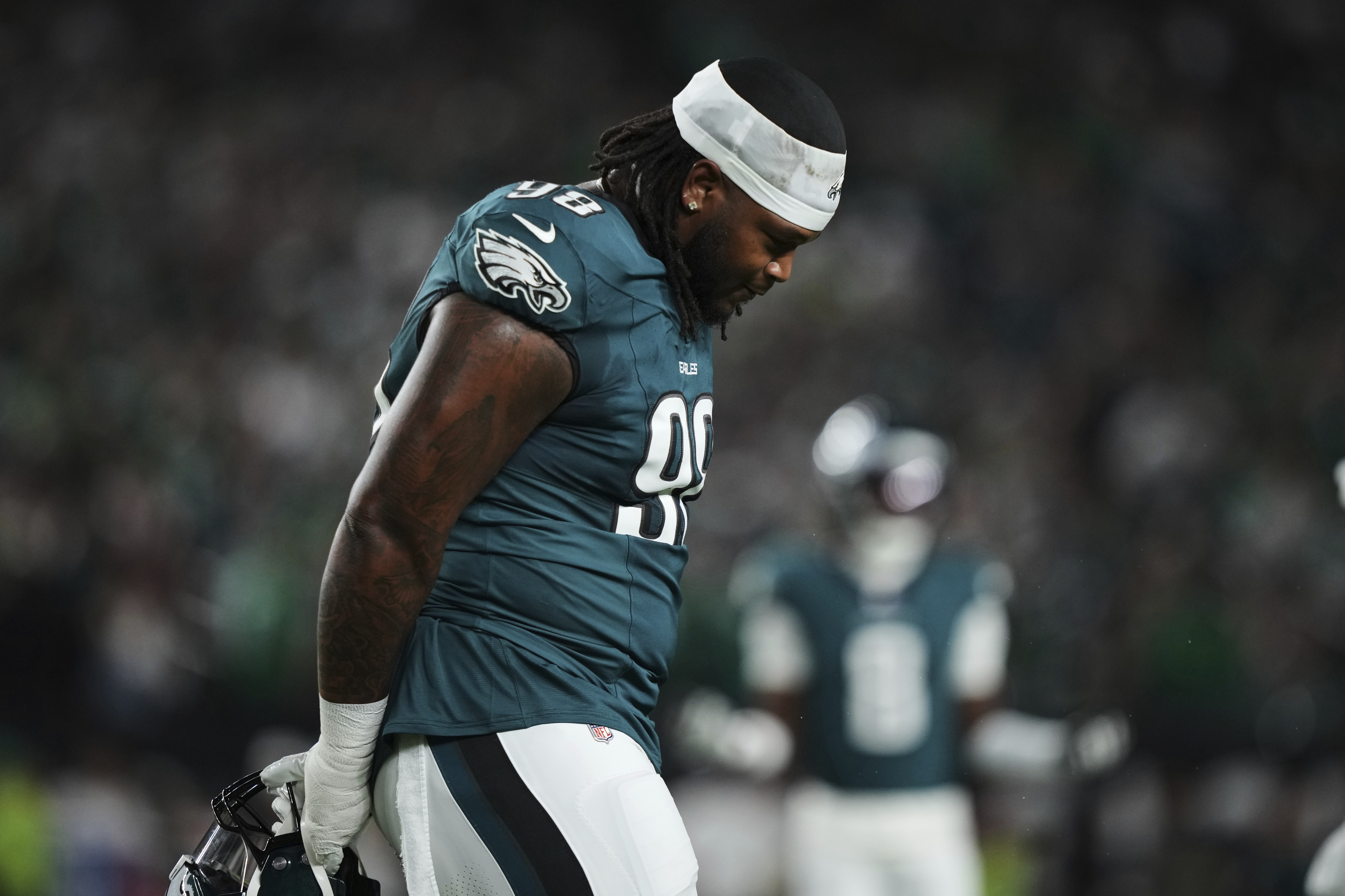 Philadelphia Eagles defensive tackle Jalen Carter walks off the field after being disqualified for unsportsman like conduct before an NFL football game against the Dallas Cowboys Thursday, Sept. 4, 2025, in Philadelphia. 