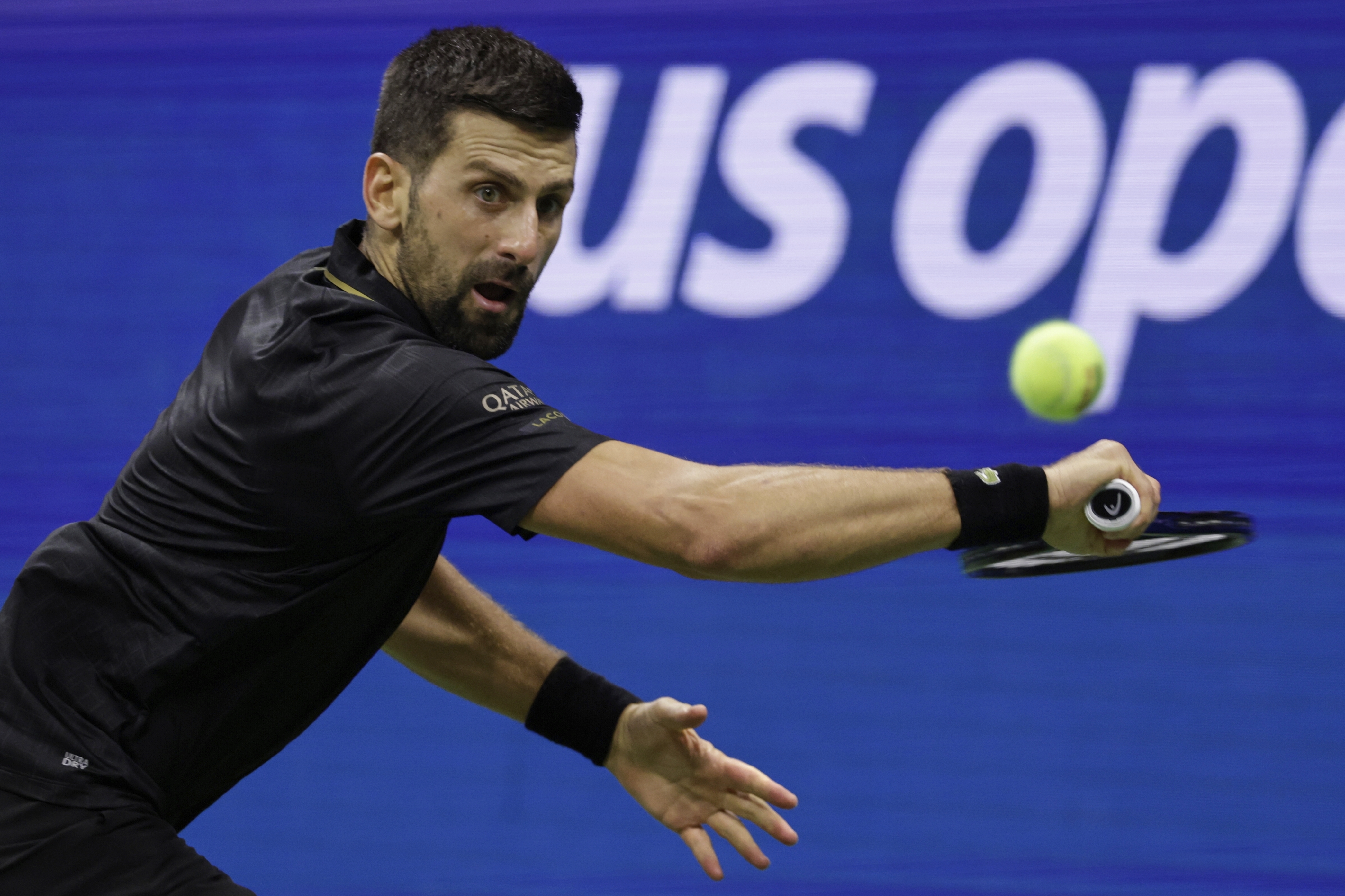 Novak Djokovic, of Serbia, returns a shot against Taylor Fritz, of the United States, during the quarterfinal round of the U.S. Open tennis championships, Tuesday, Sept. 2, 2025, in New York.
