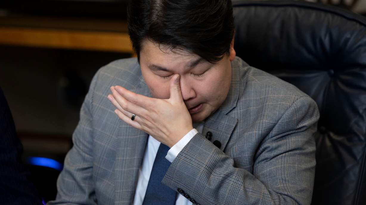 John Shin wipes away tears as he speaks to the media about his detainment in an immigration detention facility in Colorado at the law office of Adam Crayk in Millcreek on Friday.